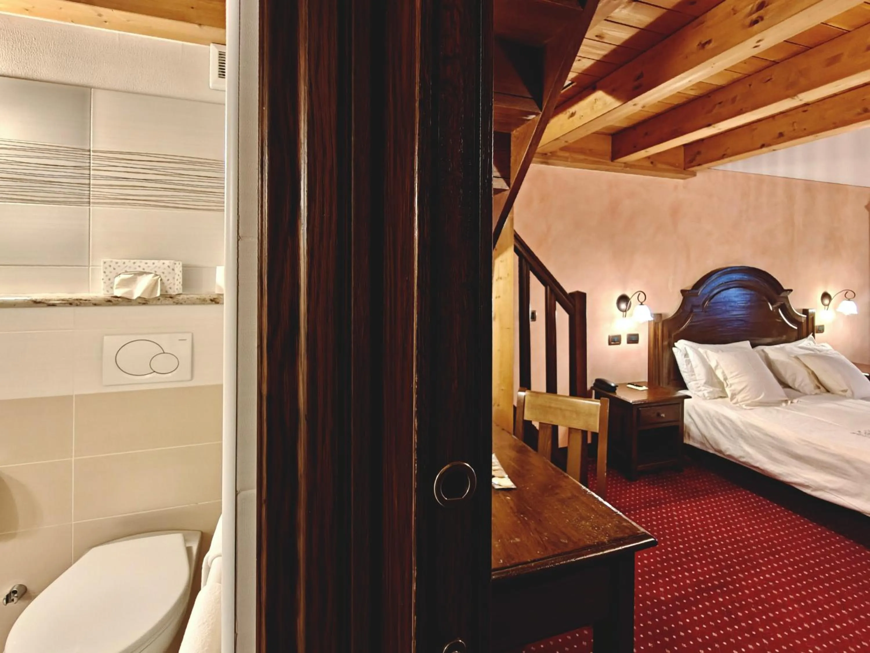 Bed in Hotel L' Aiglon