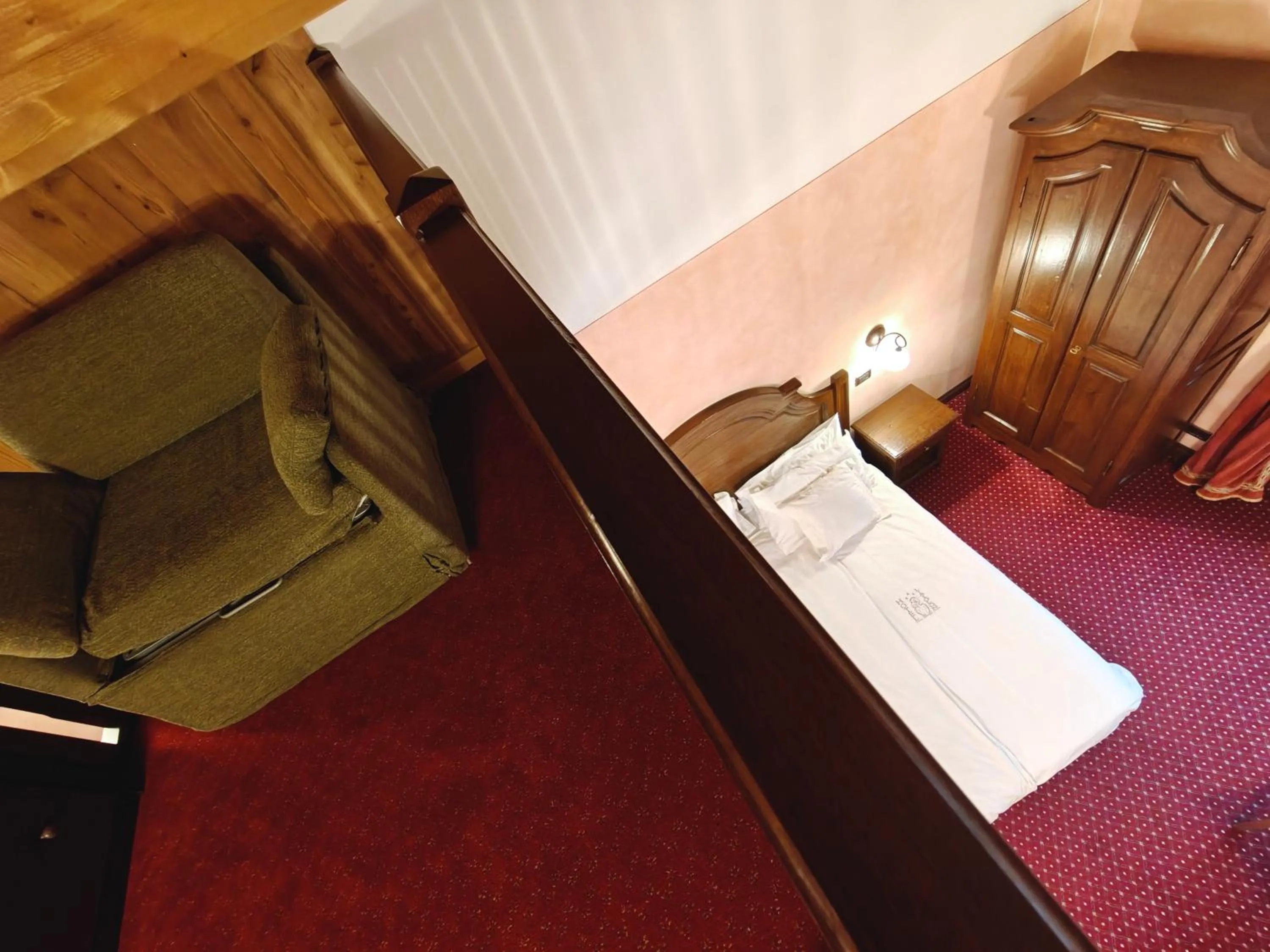 Bed in Hotel L' Aiglon