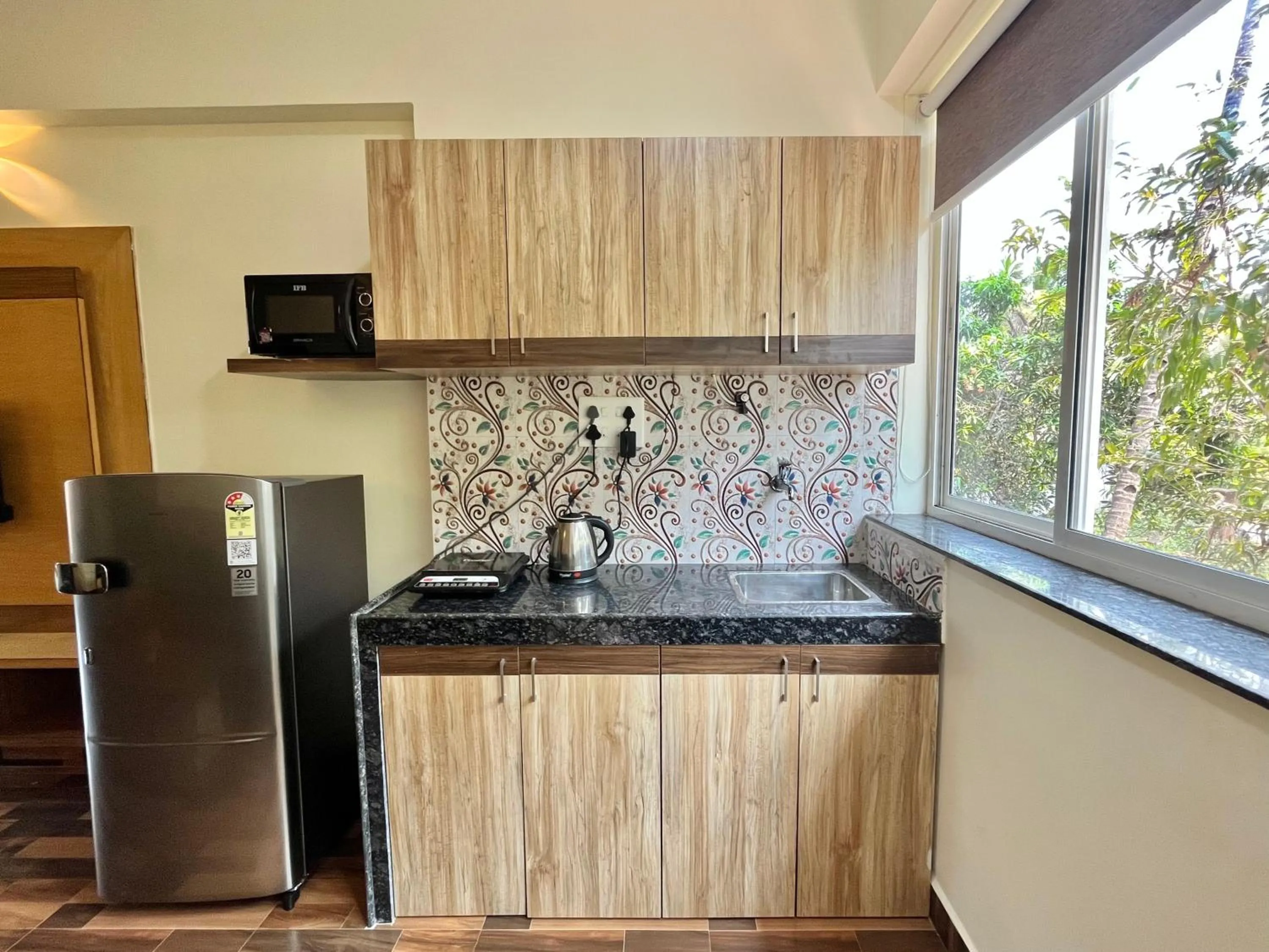 Kitchen or kitchenette in Lykke Suites- 2-min Drive to Colva Beach-By Goan Felicidade Hospitality PVT LTD