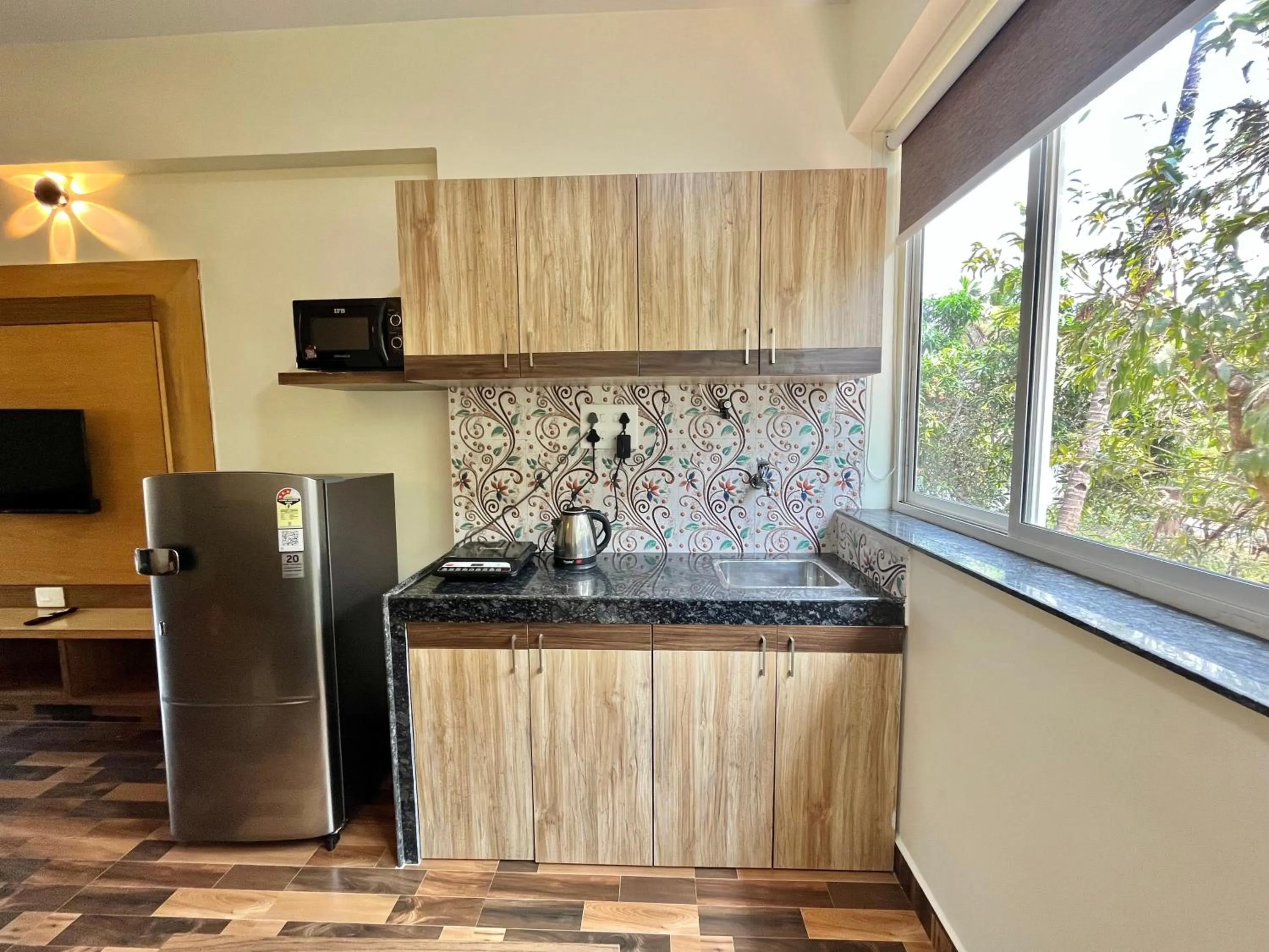 Kitchen or kitchenette in Lykke Suites- 2-min Drive to Colva Beach-By Goan Felicidade Hospitality PVT LTD