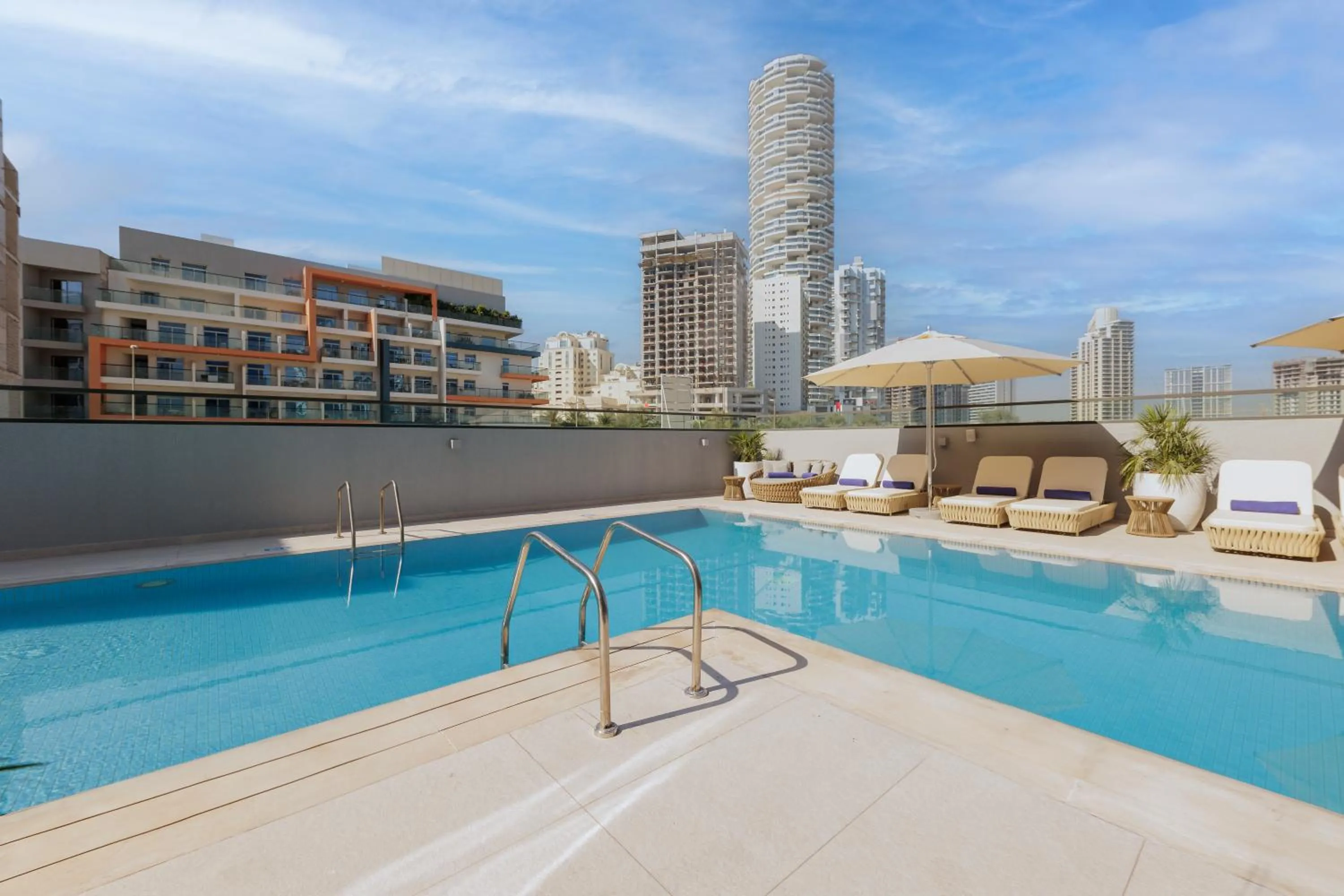 Swimming pool in Holiday Inn Dubai Village Circle by IHG