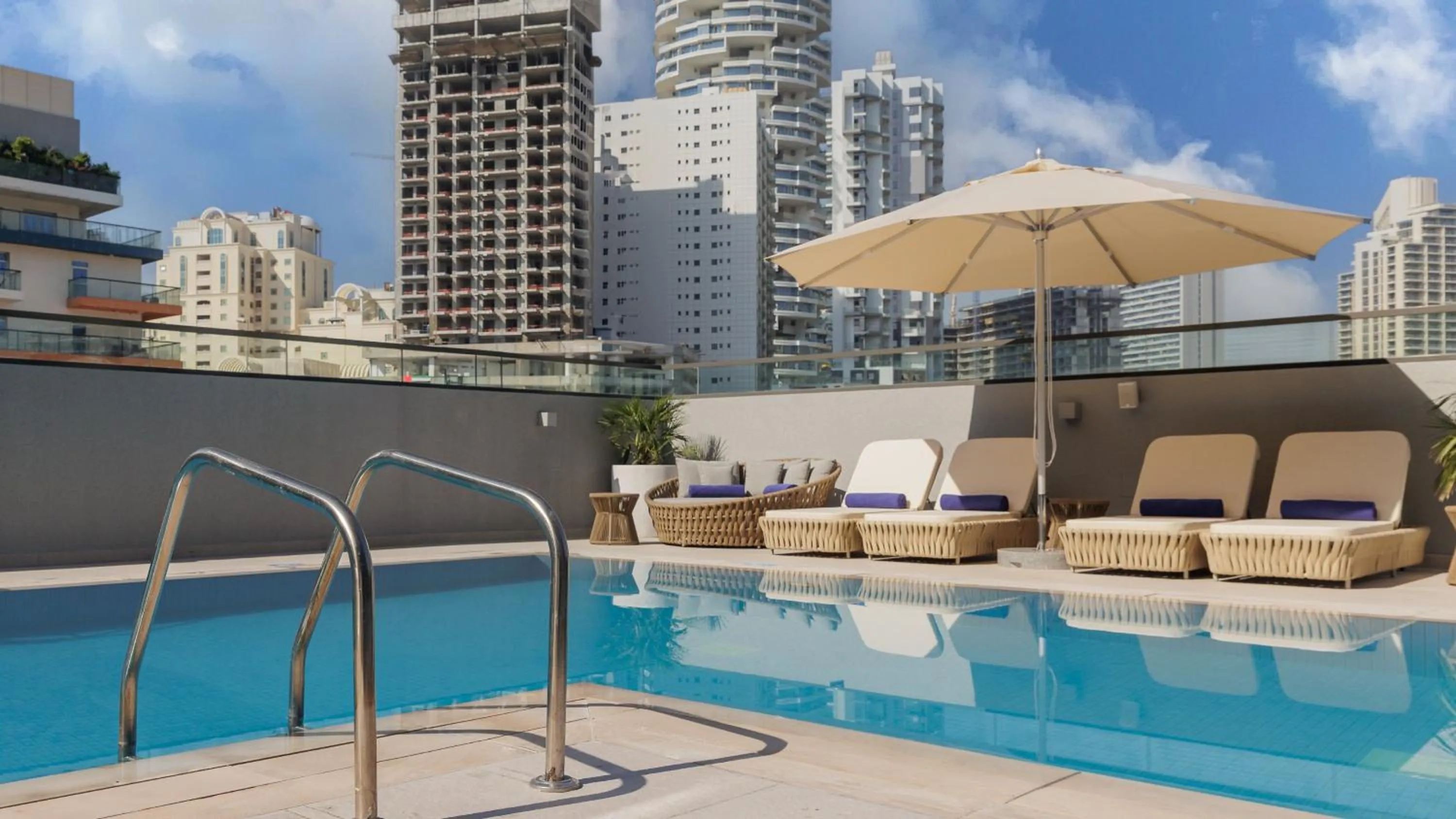 Swimming pool in Holiday Inn Dubai Village Circle by IHG