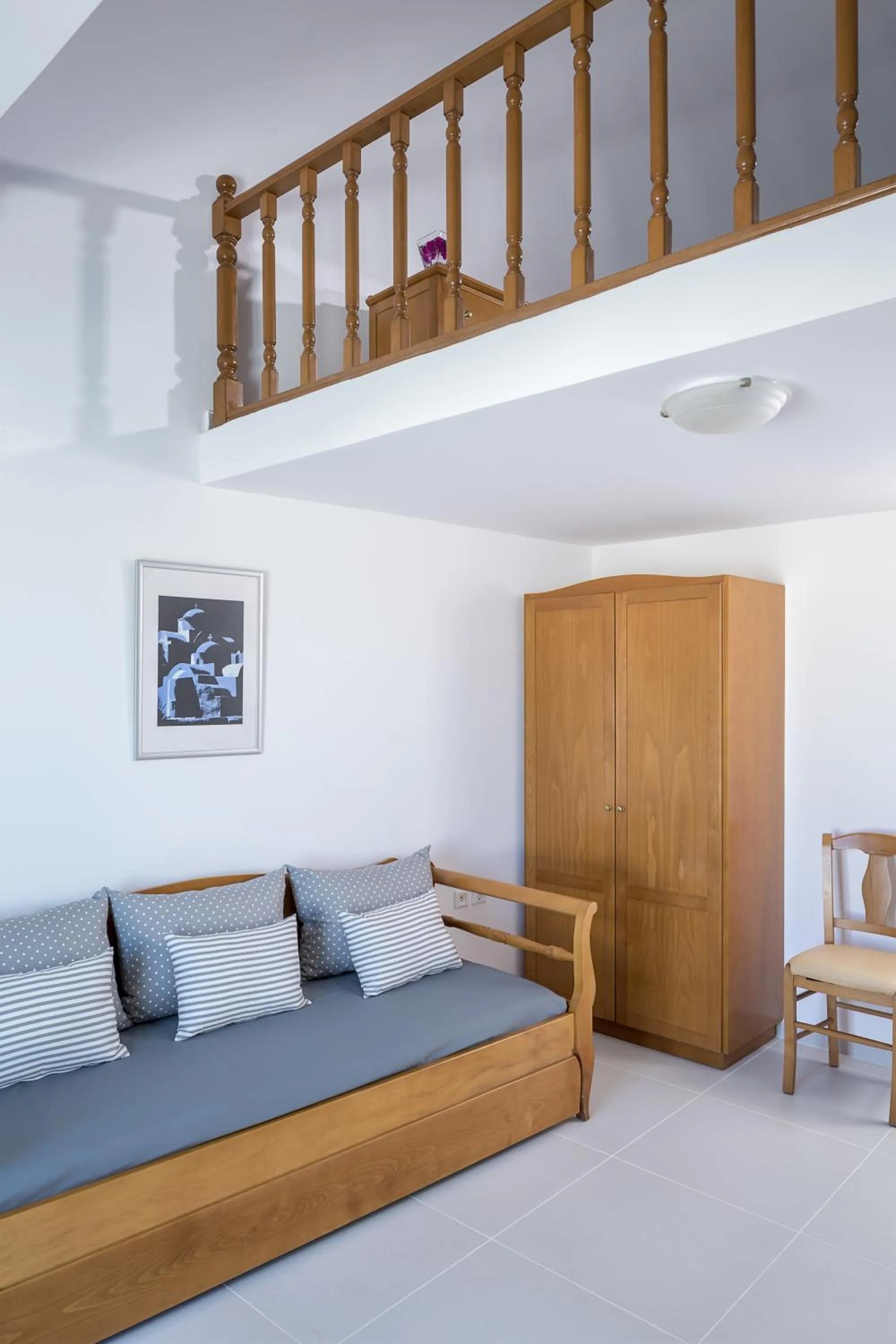 Seating area, Bed in Santellini Hotel