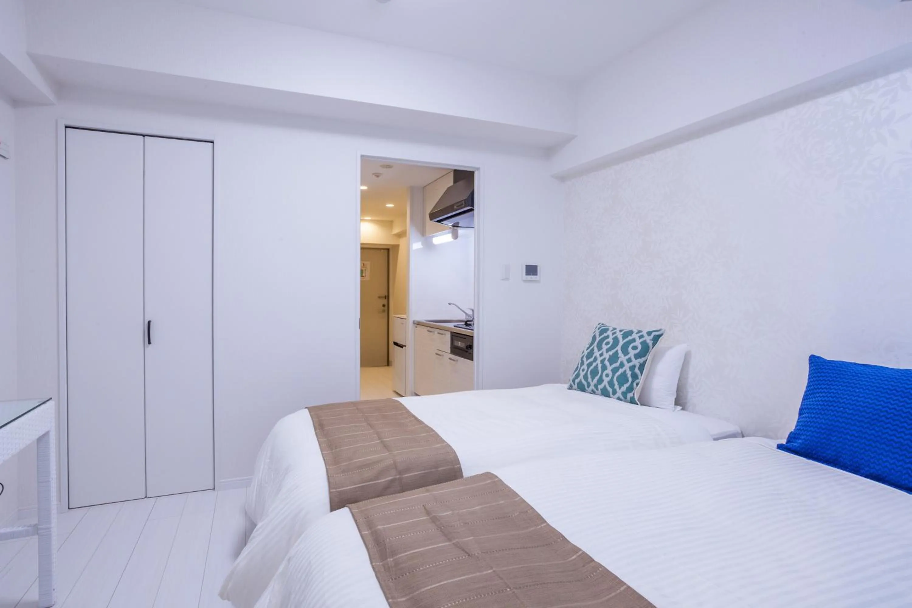 Bed in Living Inn Asahibashiekimae Anex