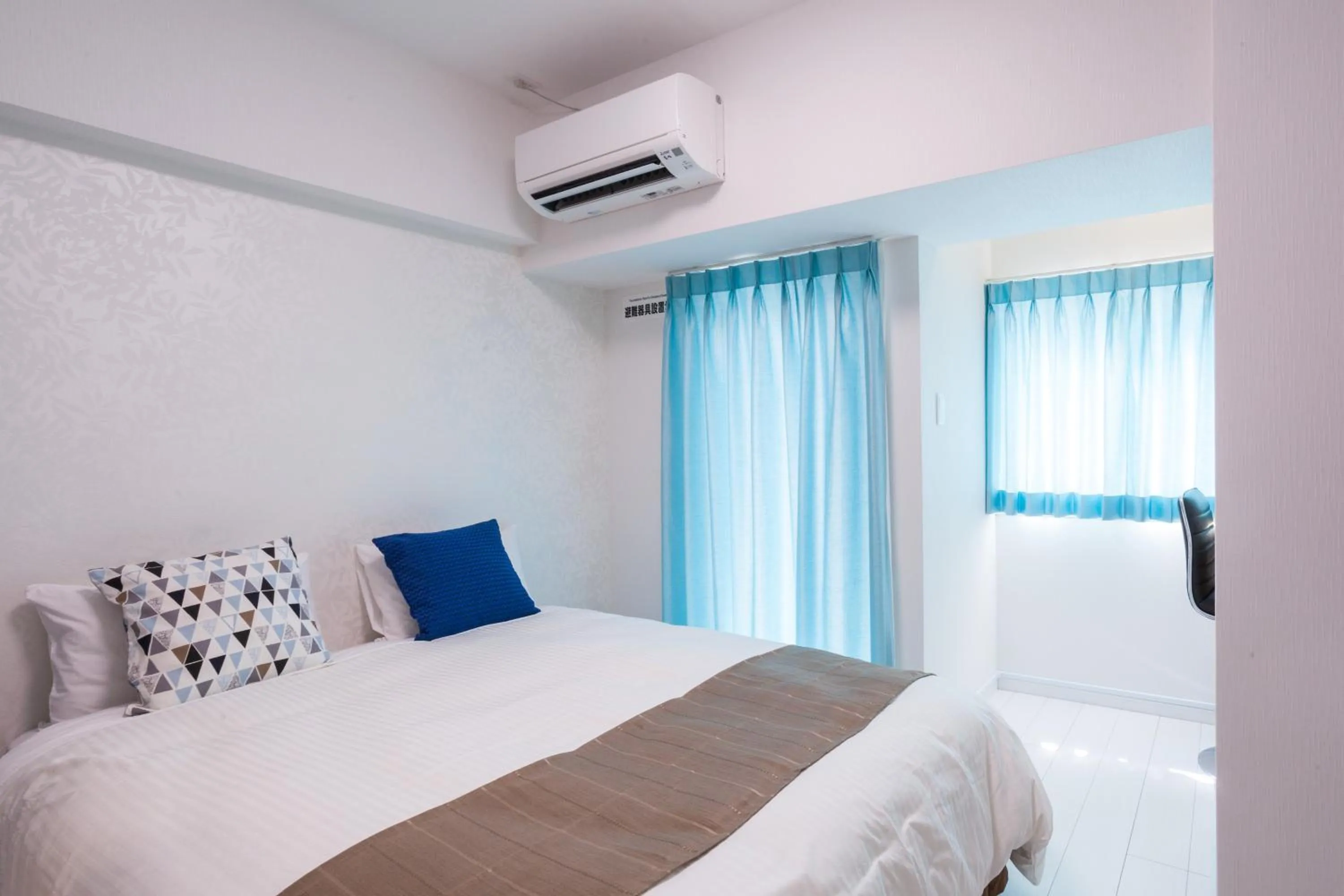 Bed in Living Inn Asahibashiekimae Anex