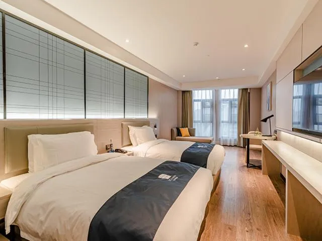 Bed in Echarm Hotel Yunmeng Mengze Lake Branch
