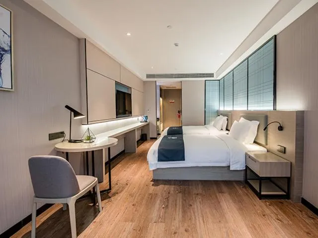 Bed in Echarm Hotel Yunmeng Mengze Lake Branch