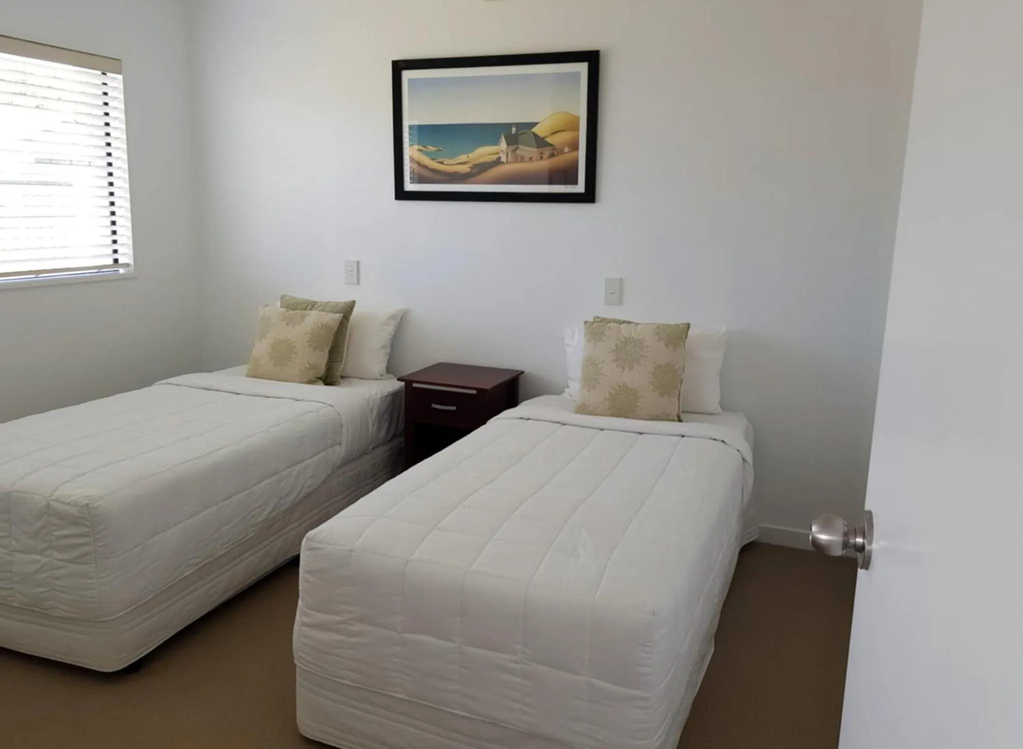 Bed in Ocean Breeze Resort Pauanui