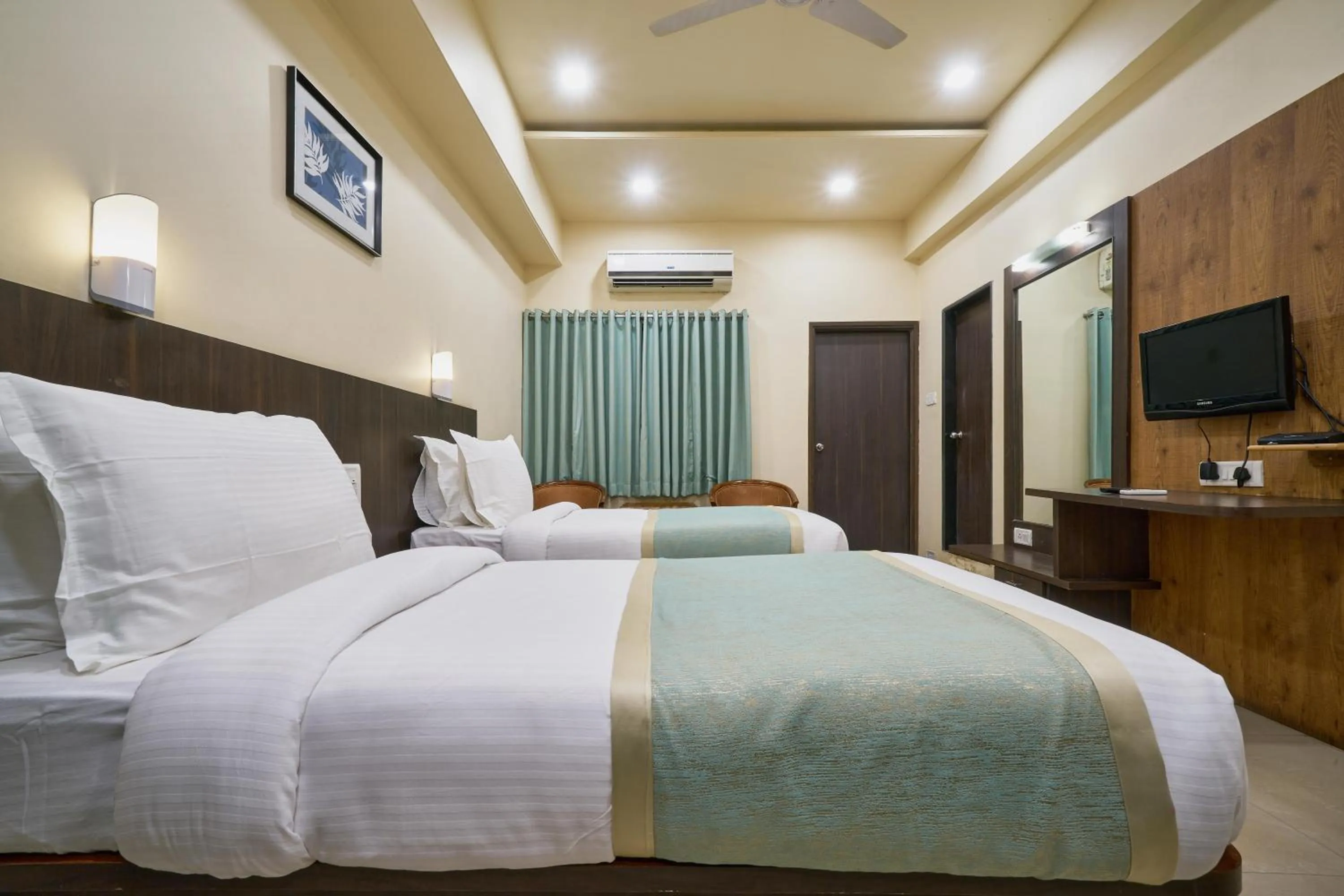 Photo of the whole room, Bed in Hotel Atria, Kolhapur