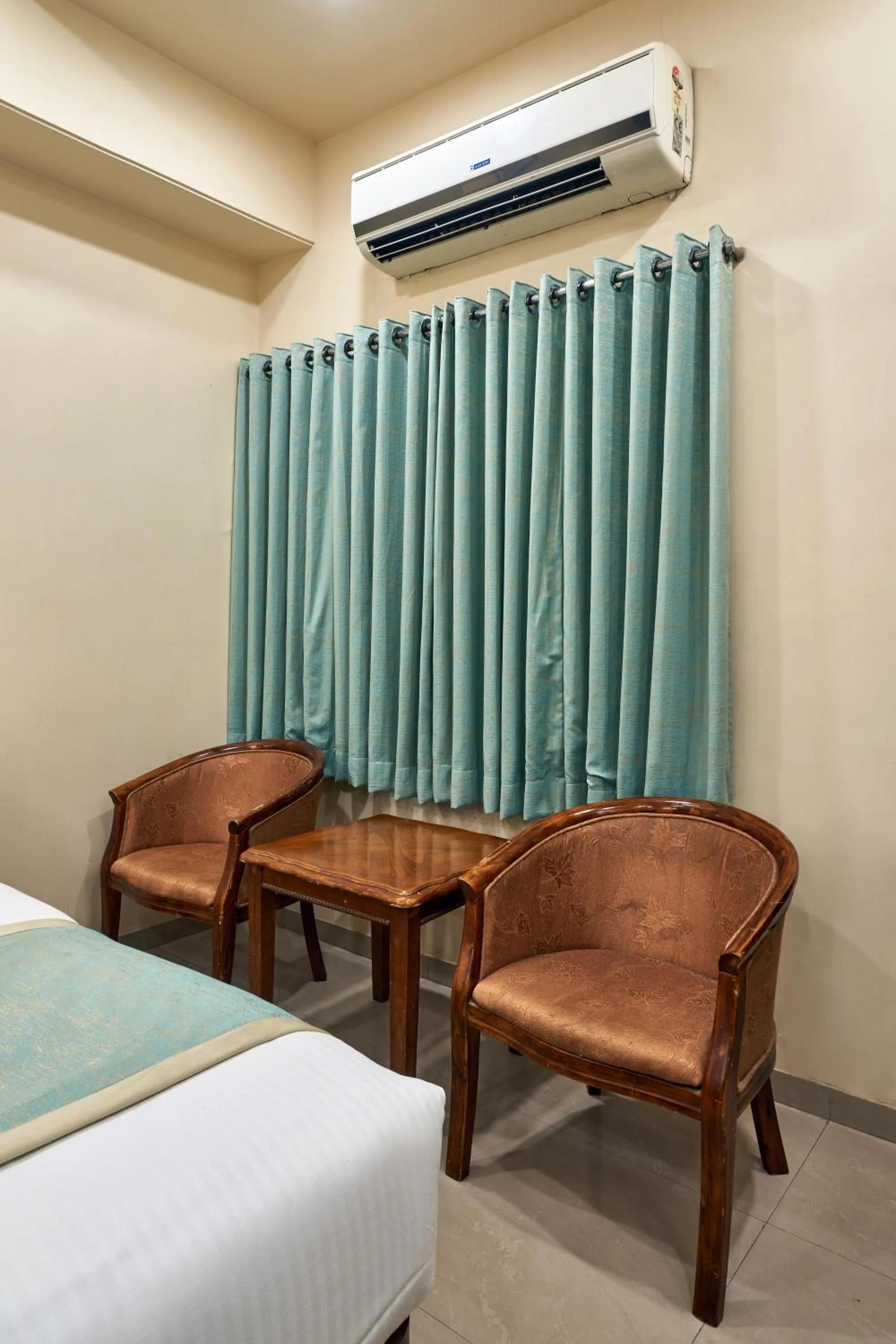Seating area, Bed in Hotel Atria, Kolhapur