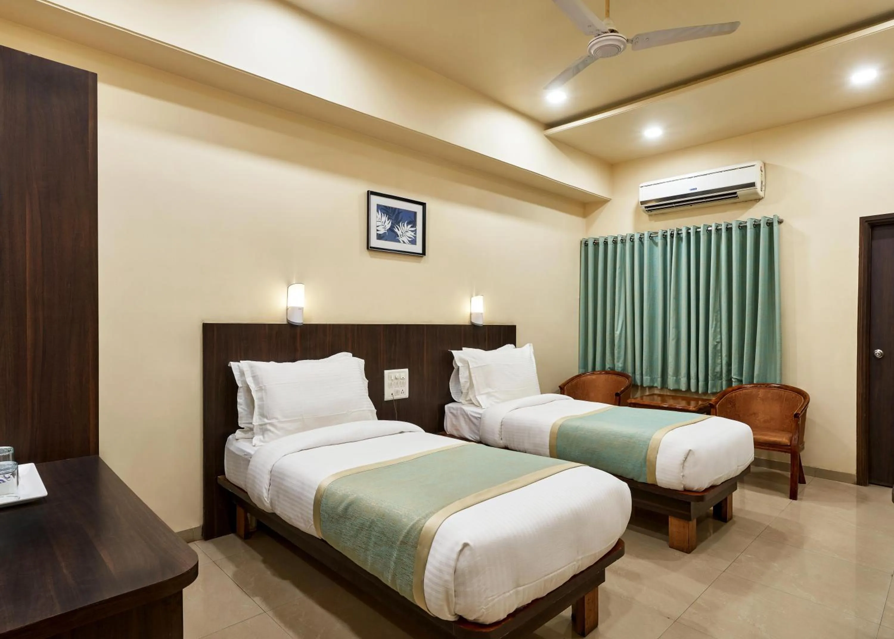 Photo of the whole room, Bed in Hotel Atria, Kolhapur