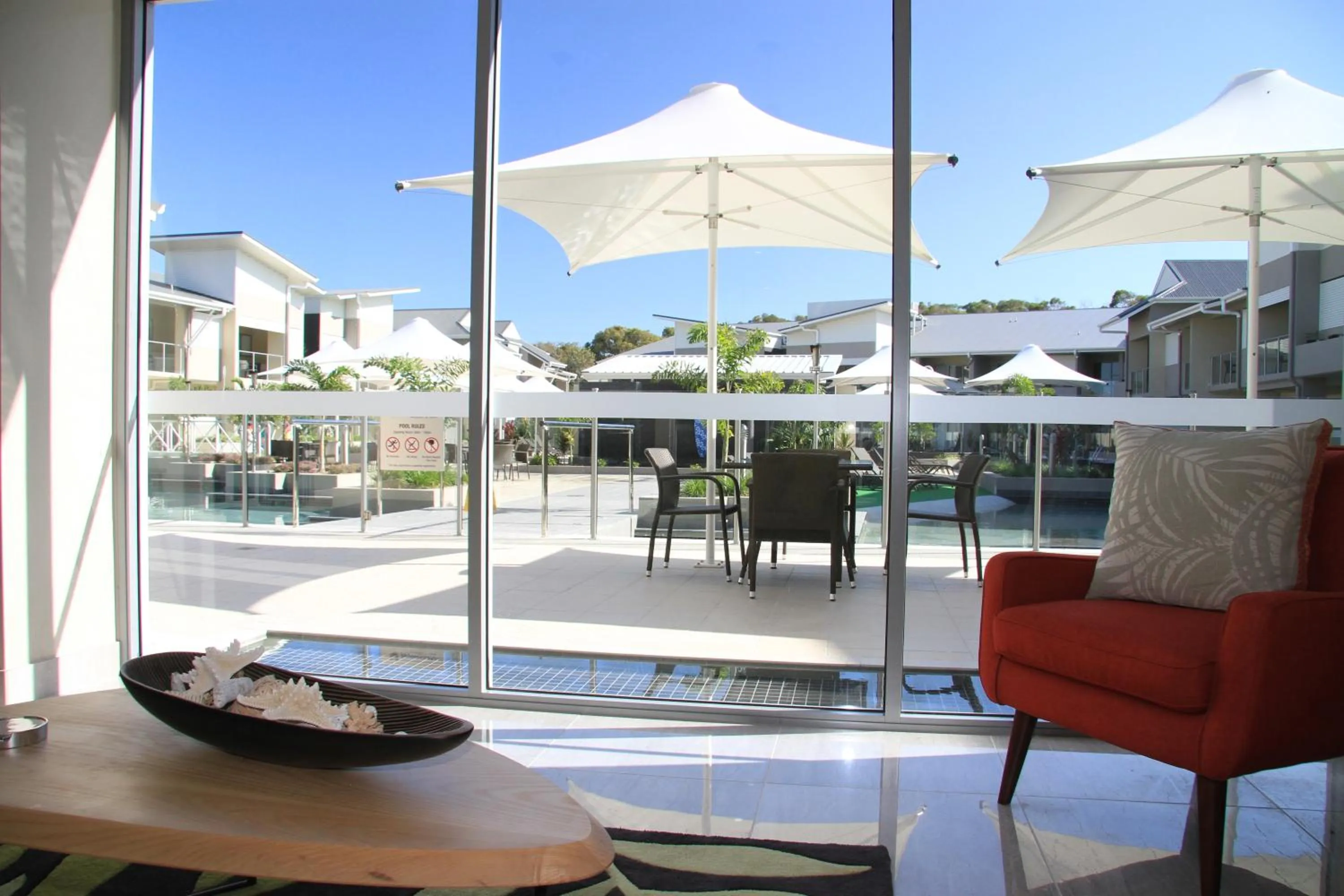 Communal lounge/ TV room in 1770 Lagoons Central Apartment Resort Official