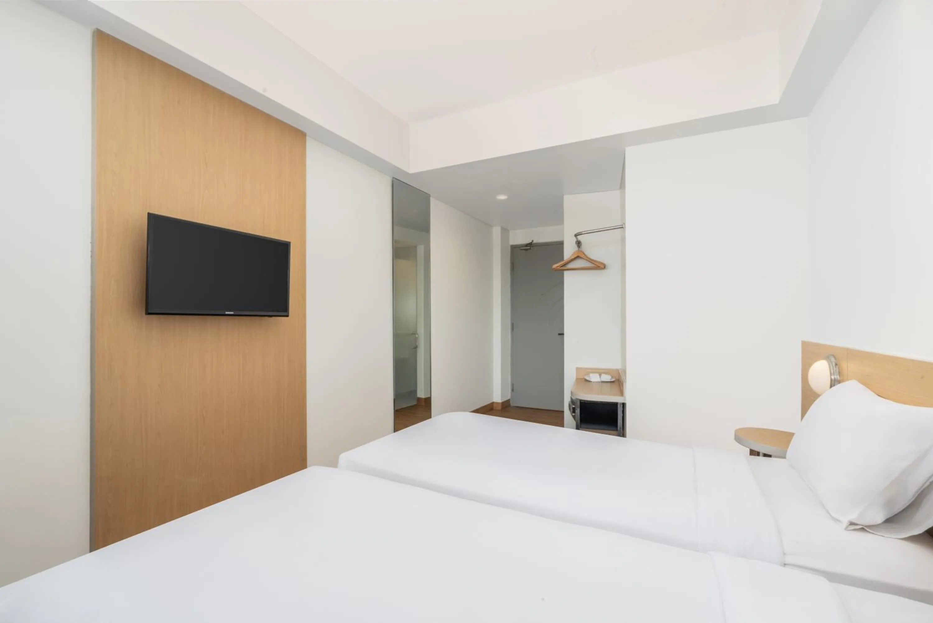 Bed in Indies Style Malioboro Hotel