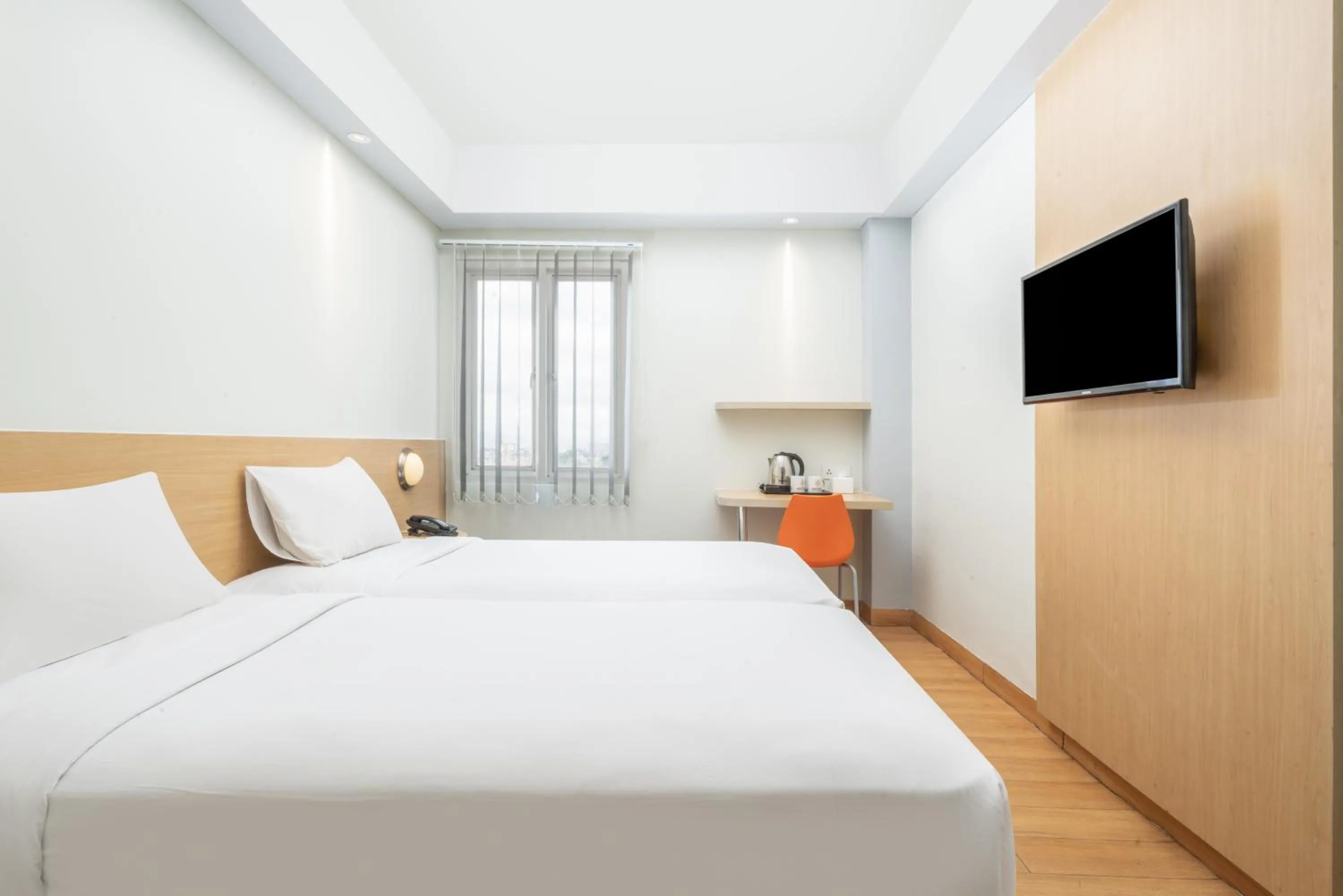 Bed in Indies Style Malioboro Hotel