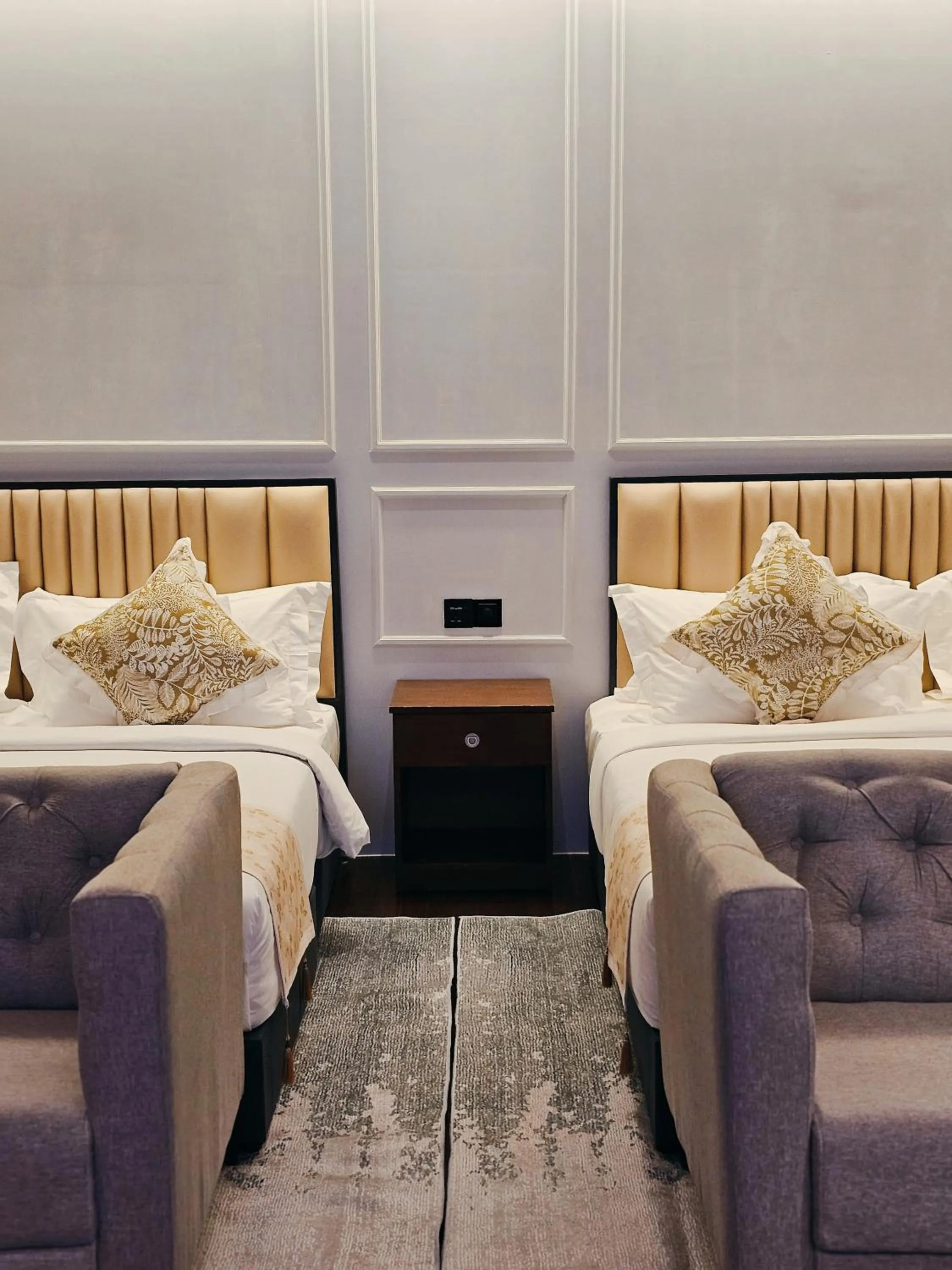 Bed in The Palm Suite at Lava Mansion