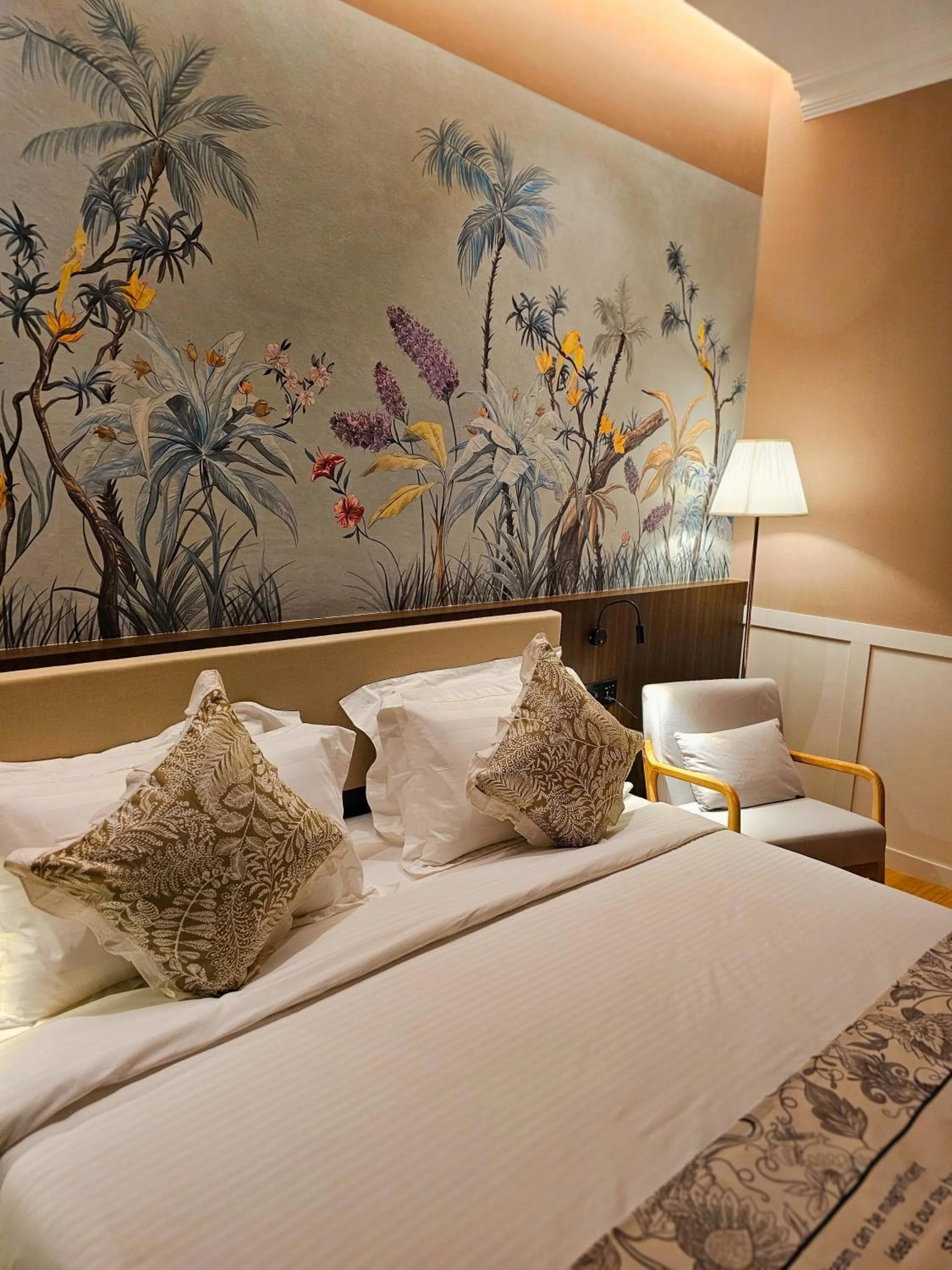 Bed in The Palm Suite at Lava Mansion