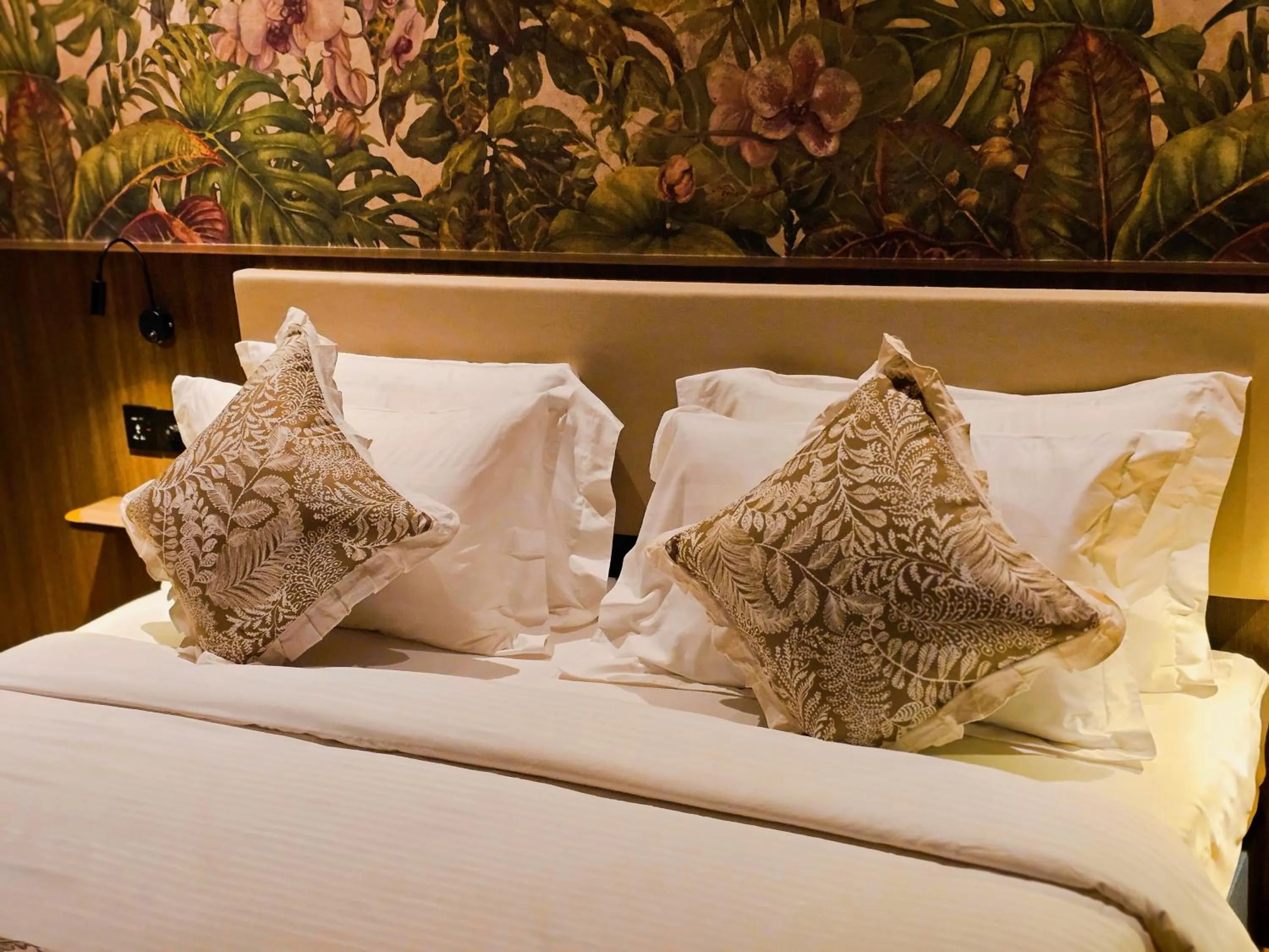 Bed in The Palm Suite at Lava Mansion