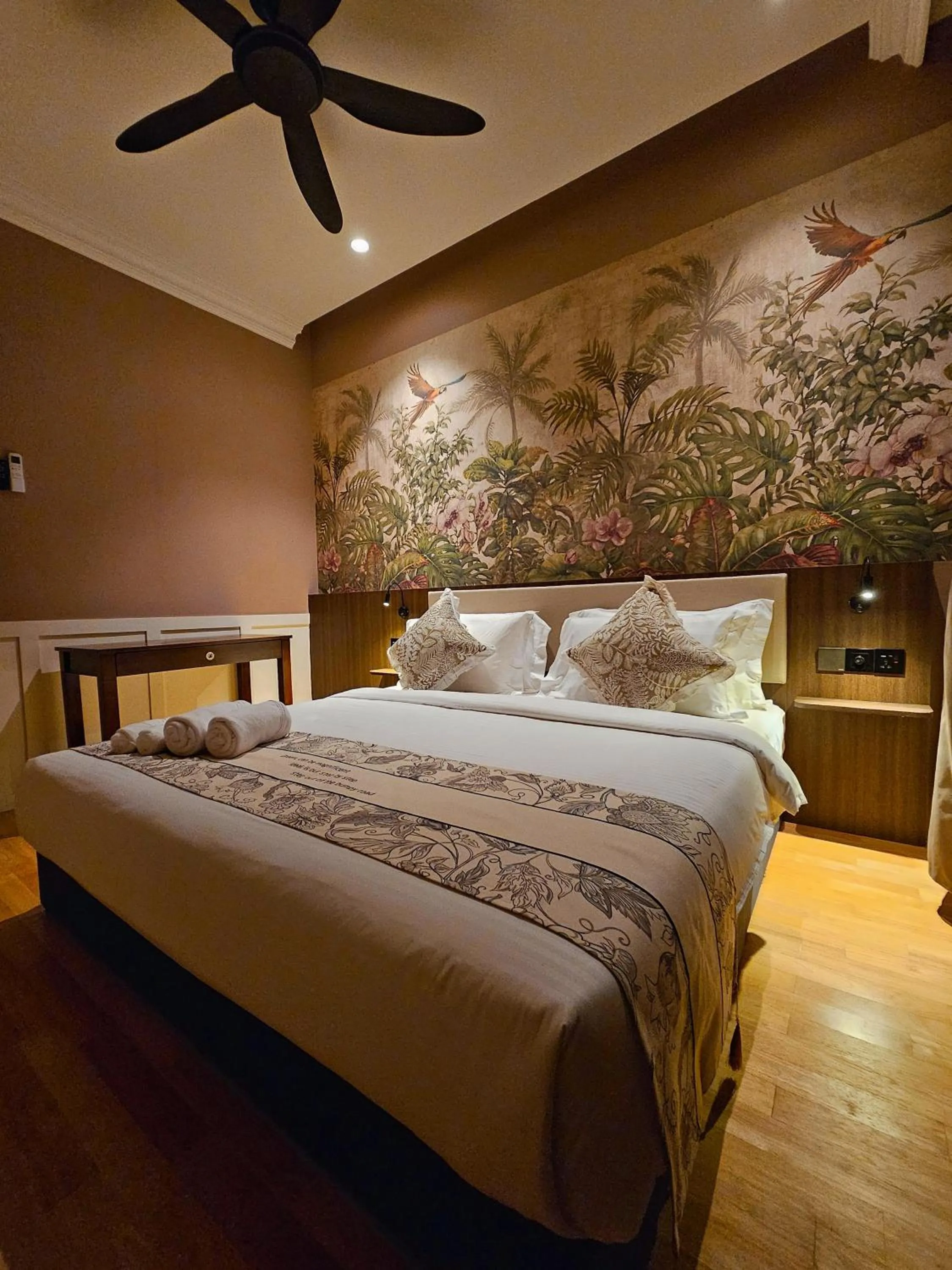 Bed in The Palm Suite at Lava Mansion