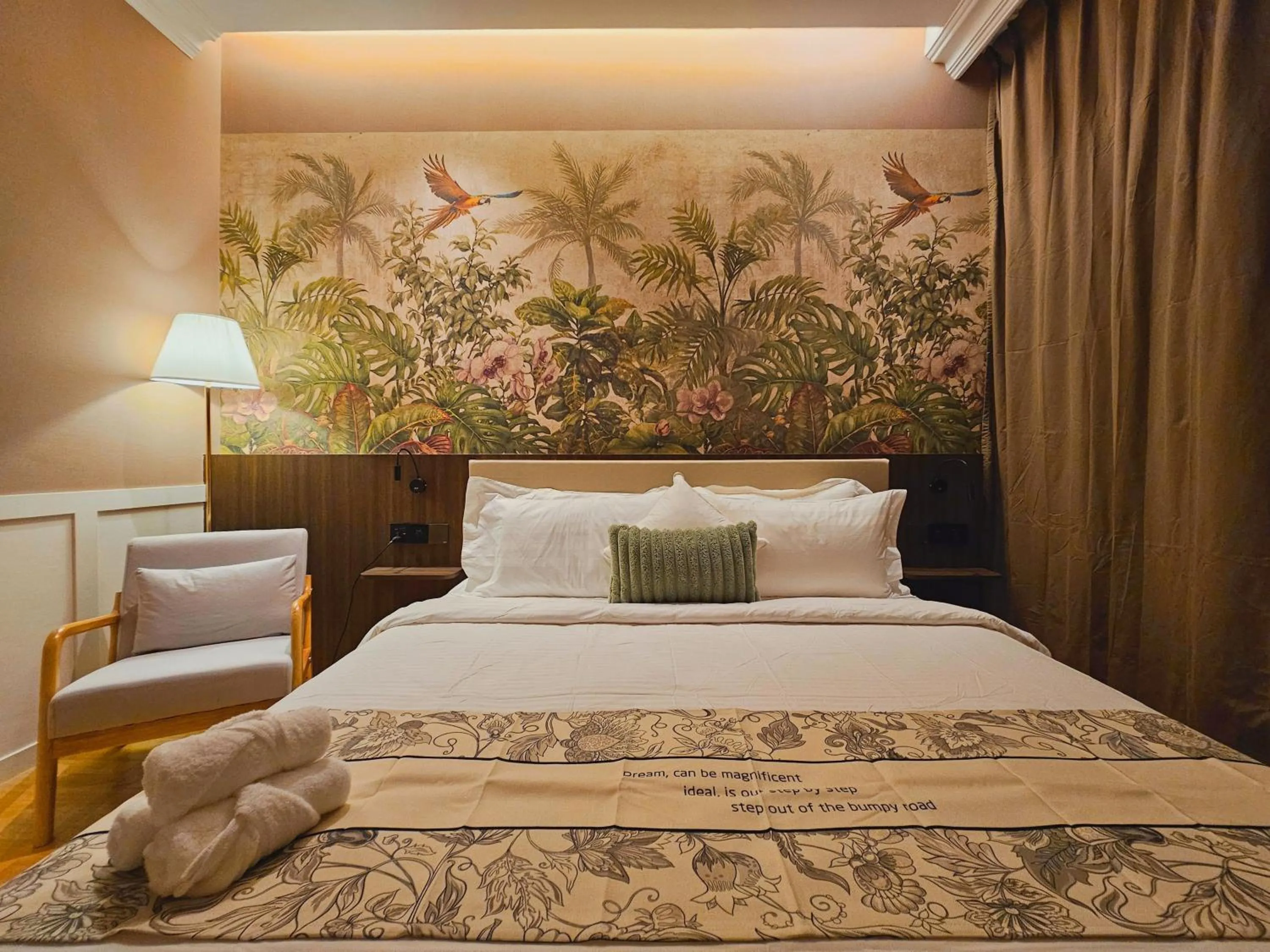 Bed in The Palm Suite at Lava Mansion