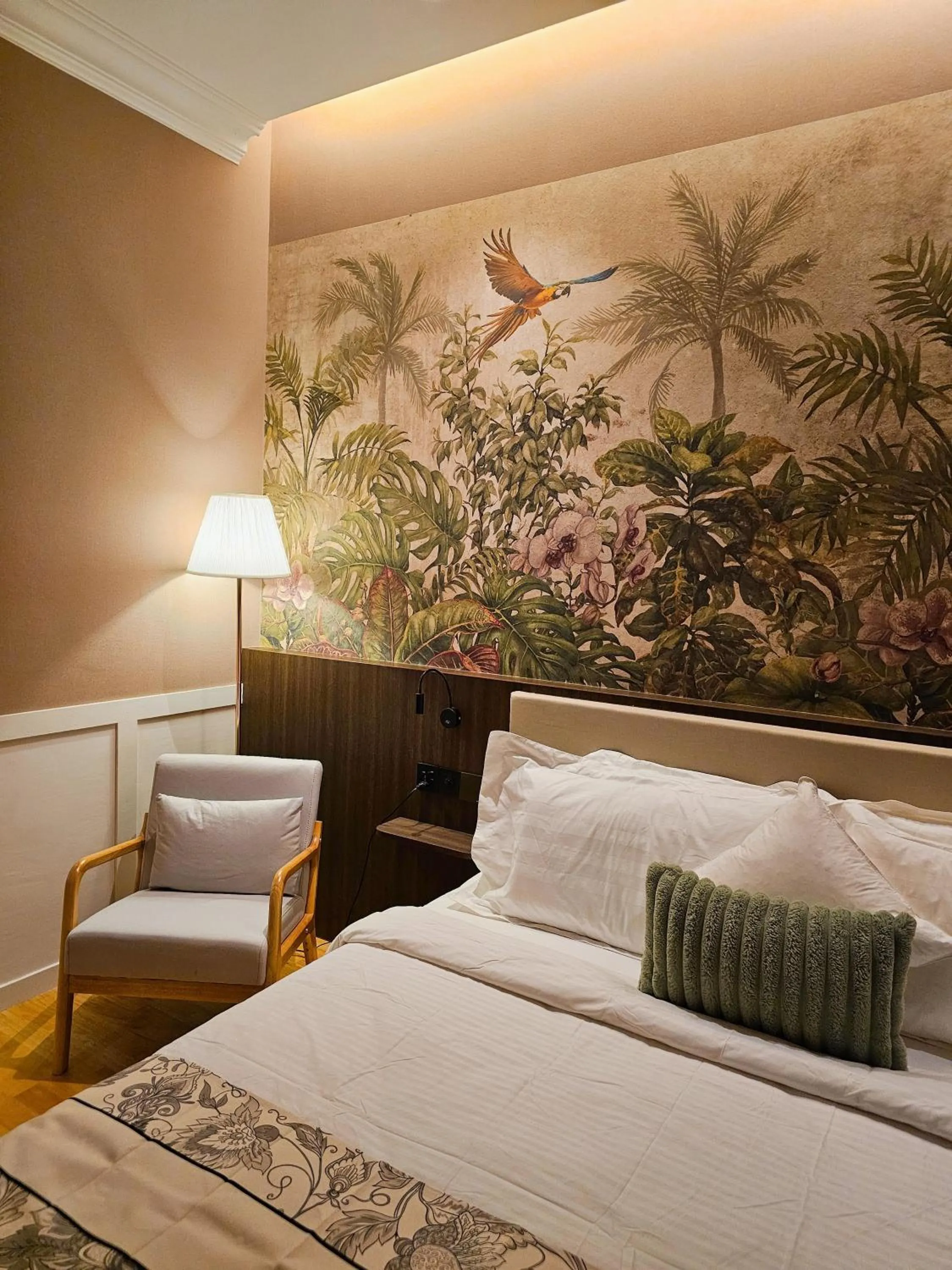 Bed in The Palm Suite at Lava Mansion