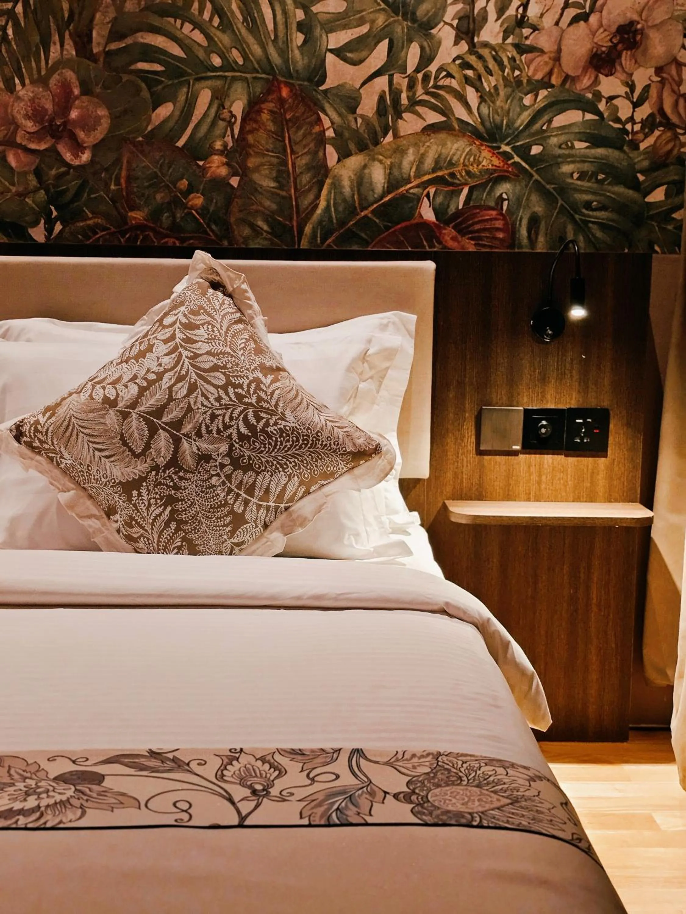 Bed in The Palm Suite at Lava Mansion