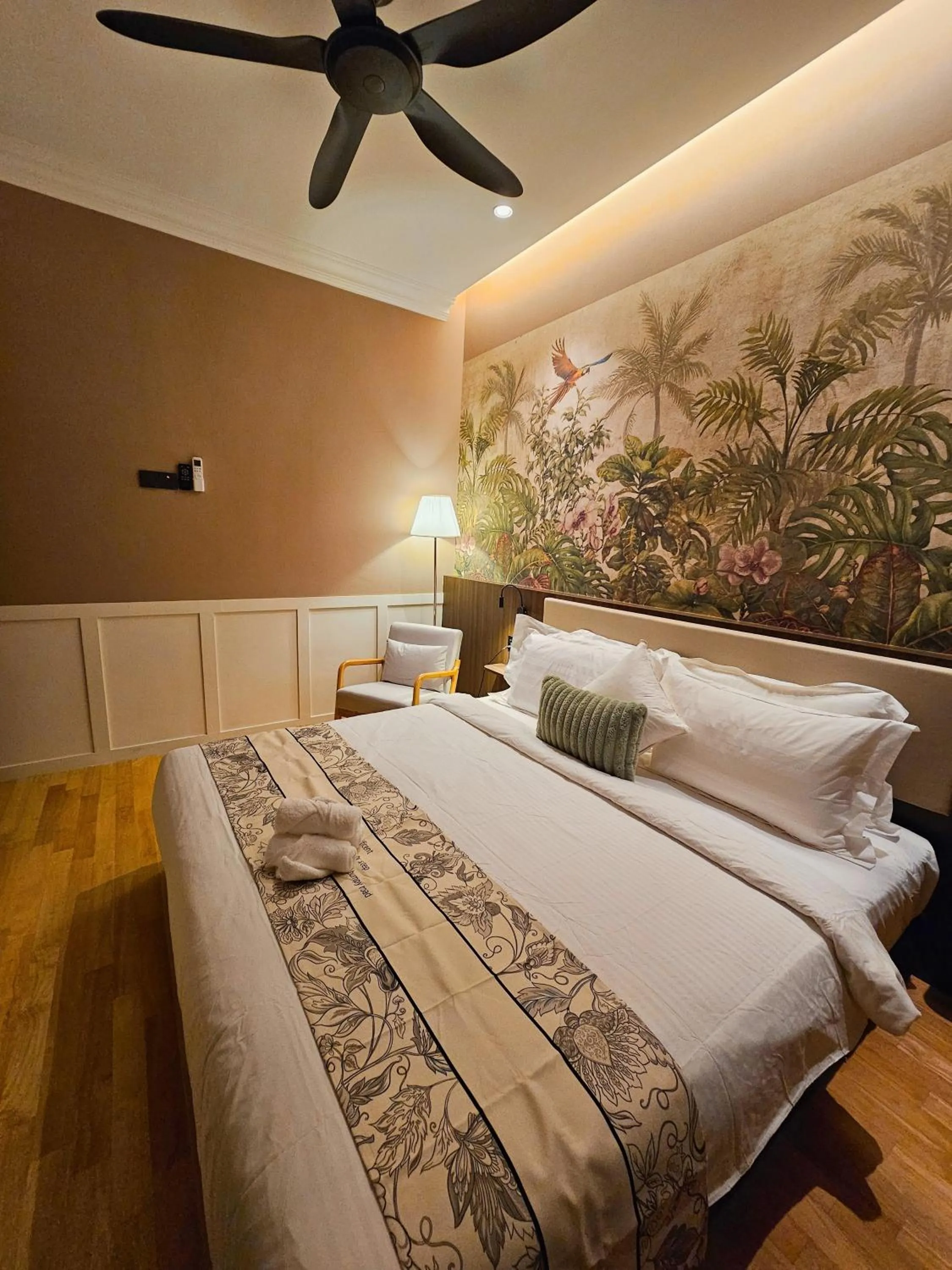 Bed in The Palm Suite at Lava Mansion