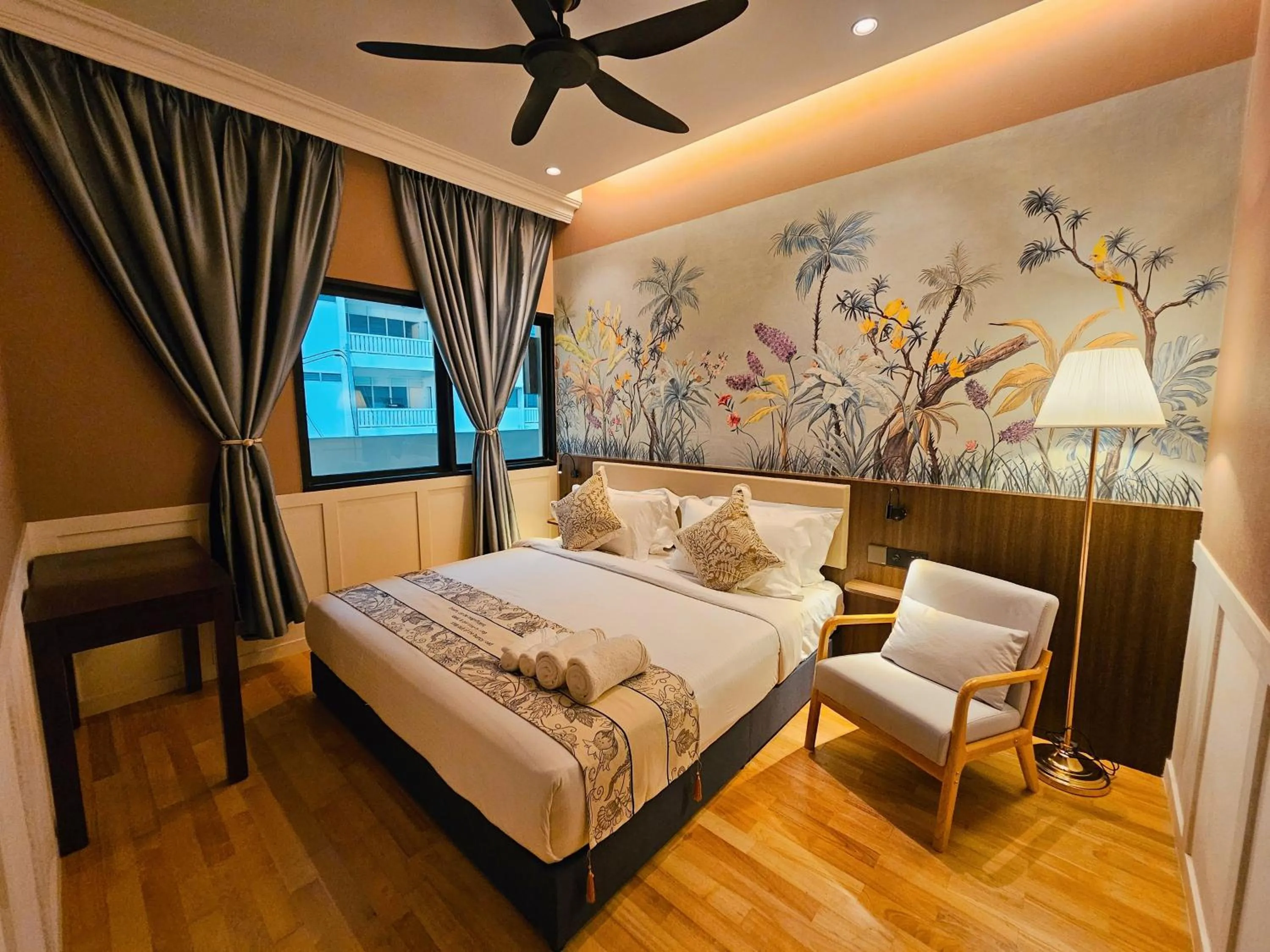 Bed in The Palm Suite at Lava Mansion