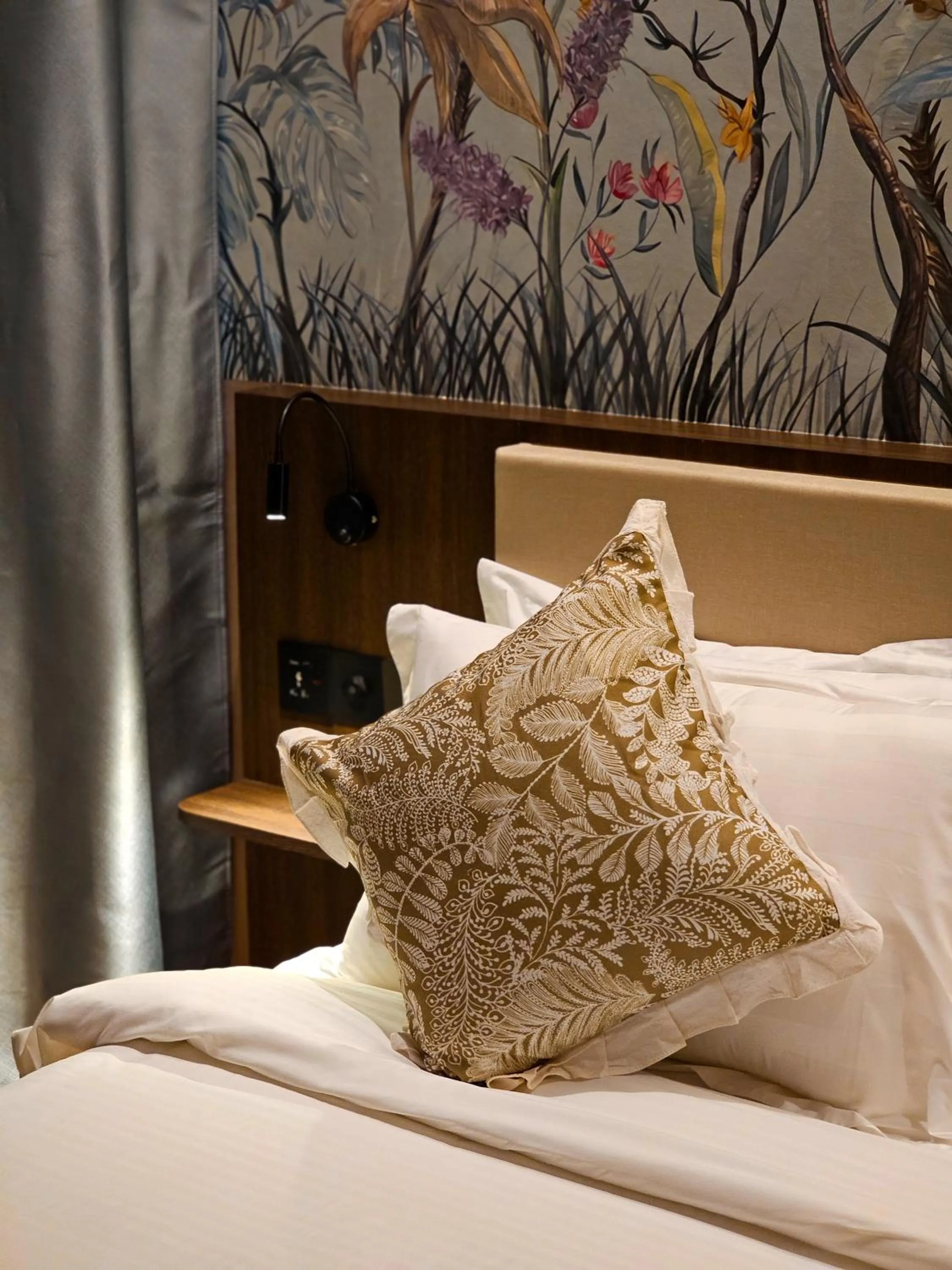 Bed in The Palm Suite at Lava Mansion