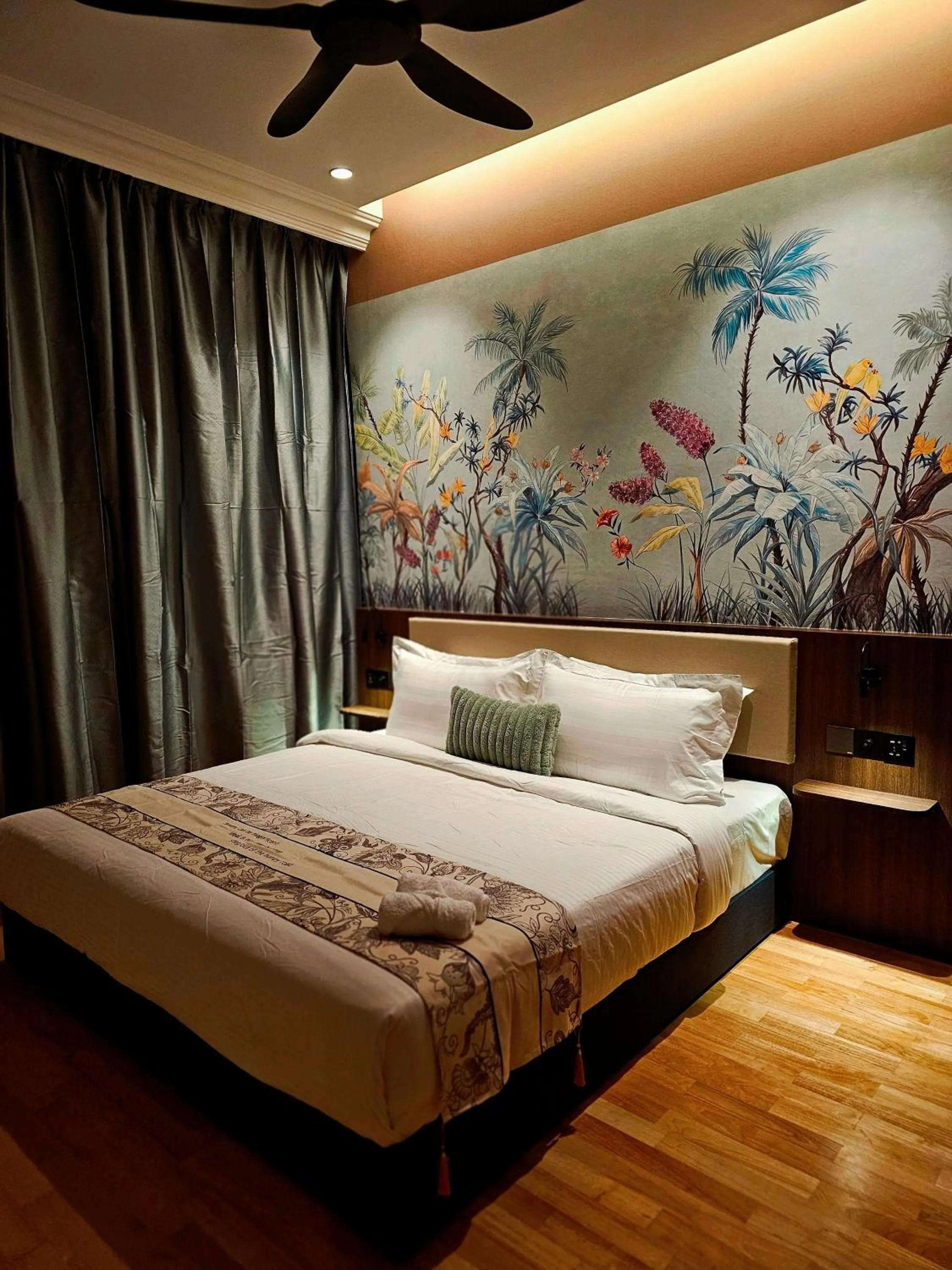 Bed in The Palm Suite at Lava Mansion