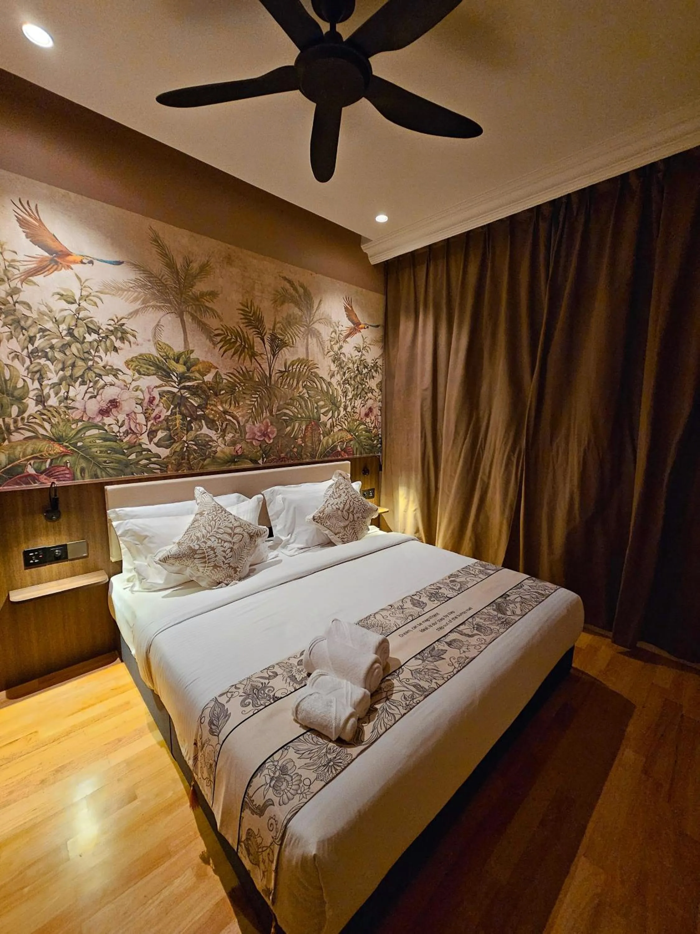 Bed in The Palm Suite at Lava Mansion