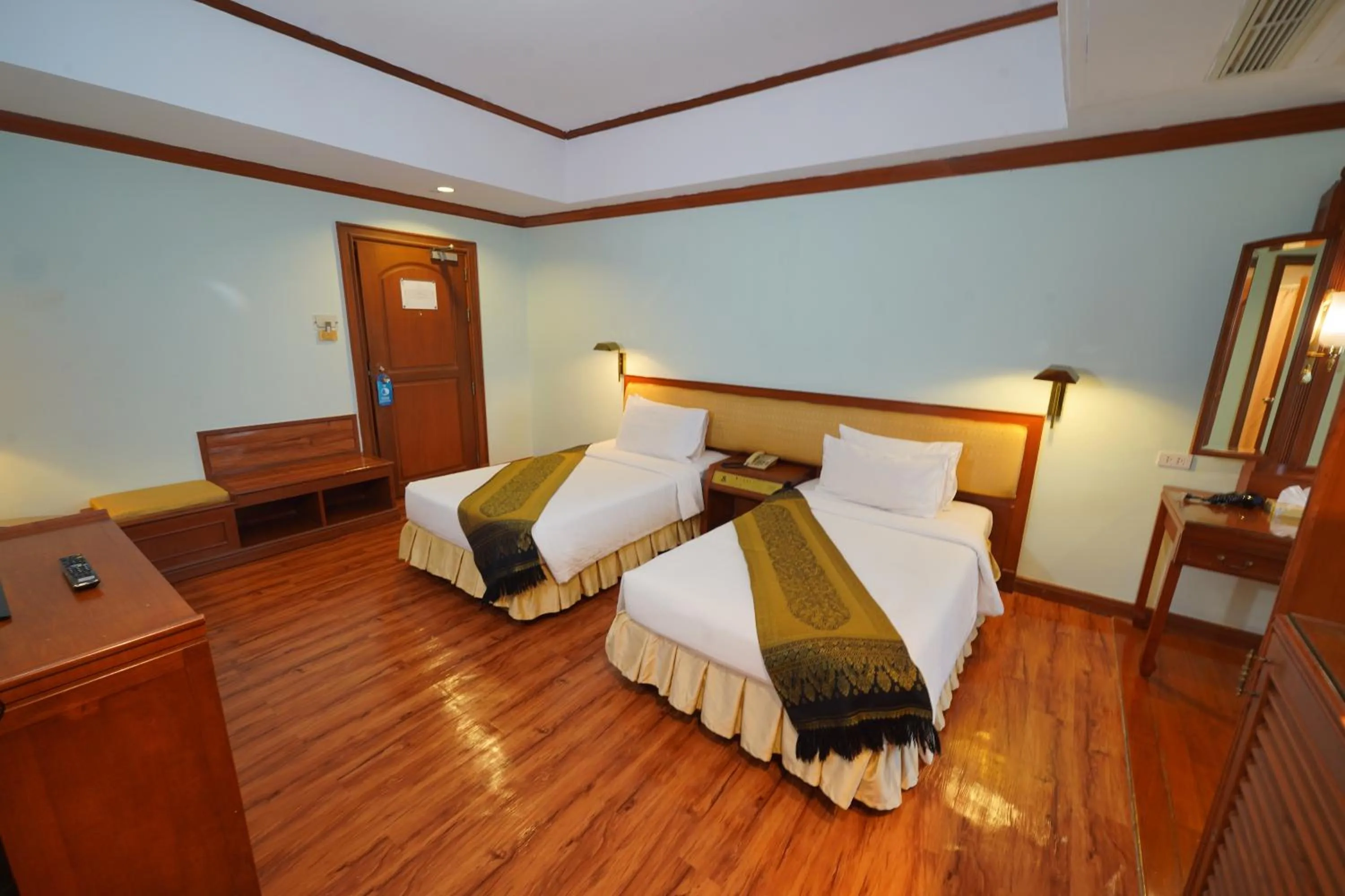 Bed in Riverside Bangkok Hotel