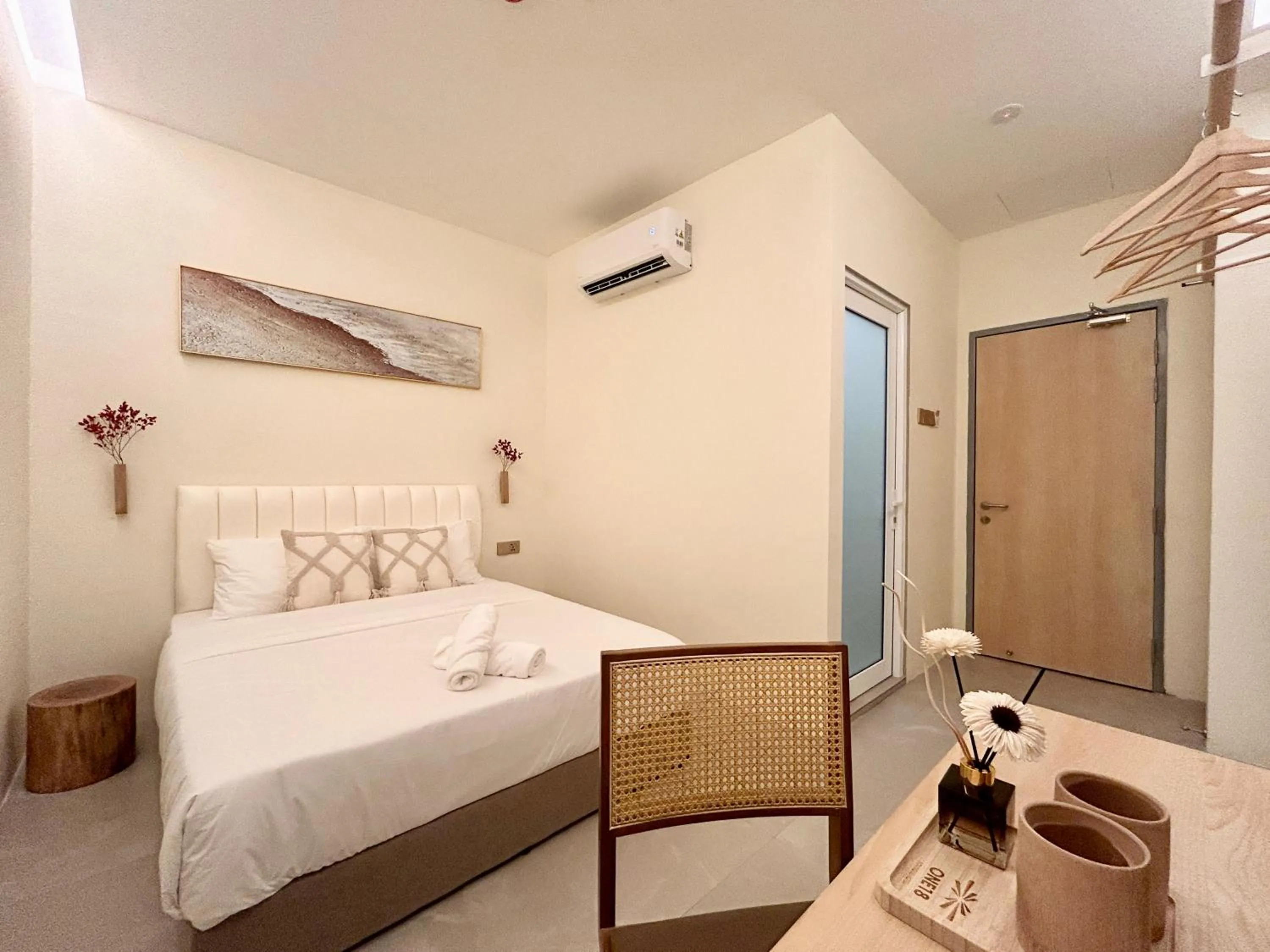 Bed in ONE18 Boutique Hotel