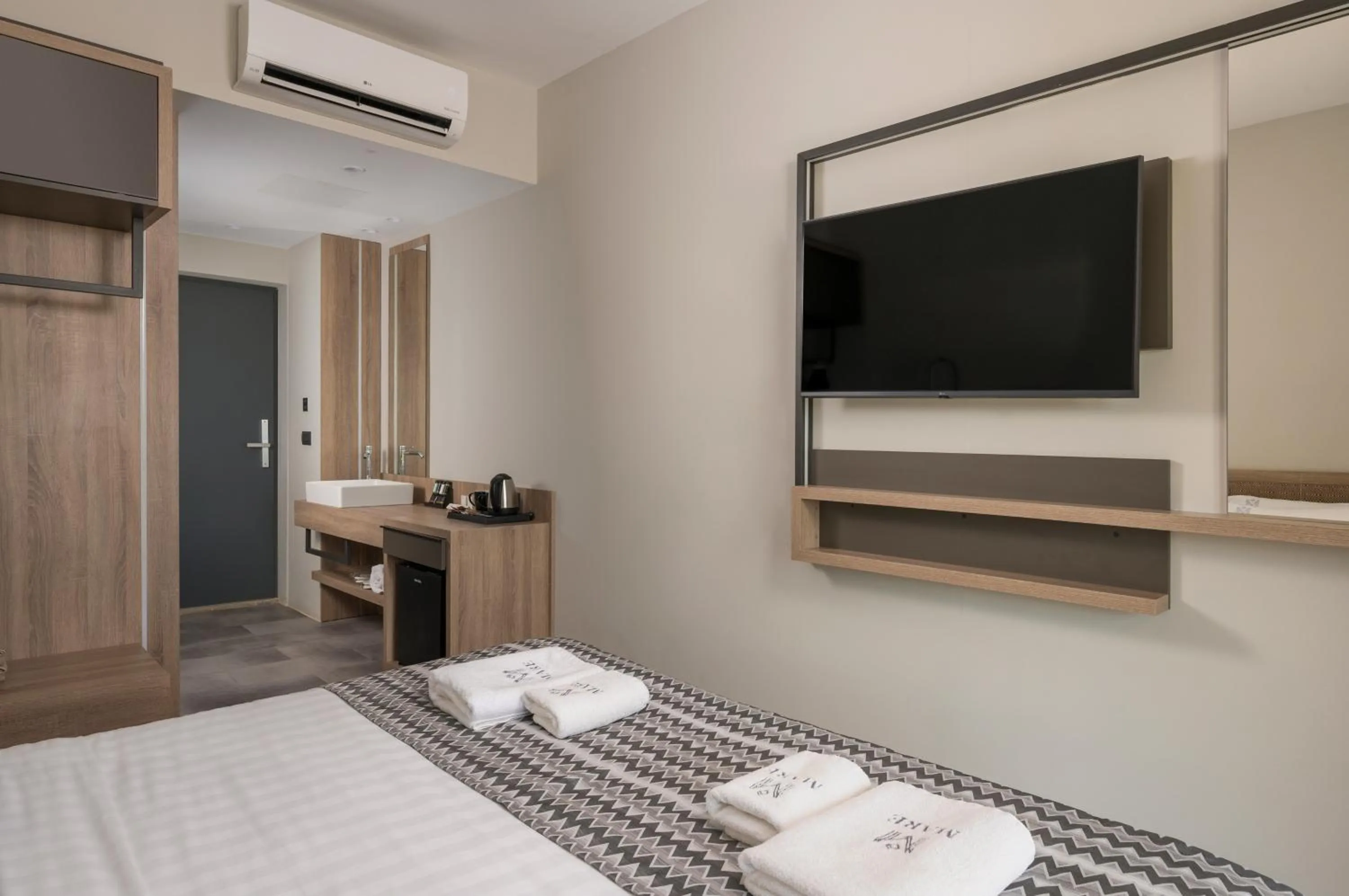 Bed in Mare Village Hotel