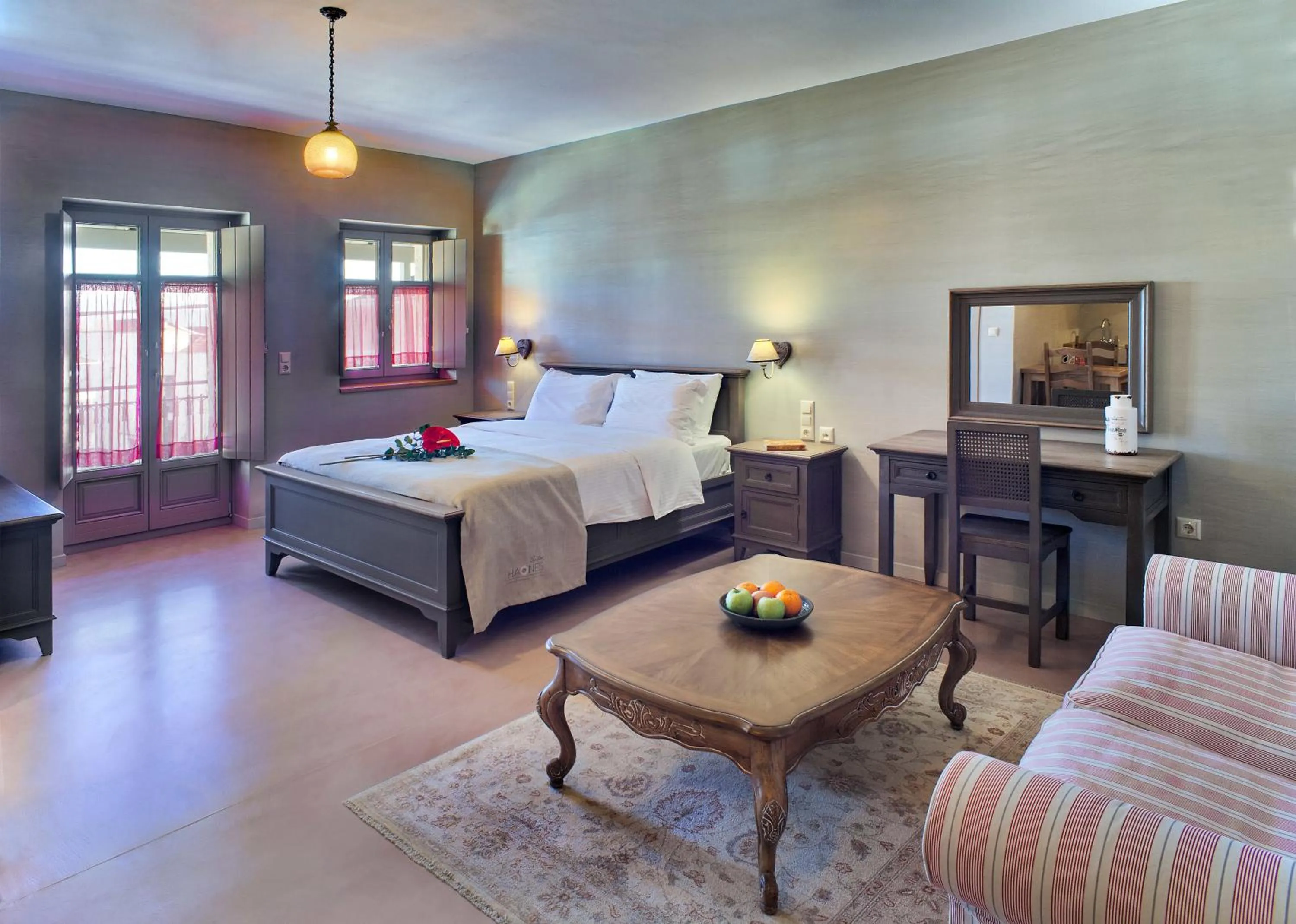 Seating area, Bed in Haones Suites