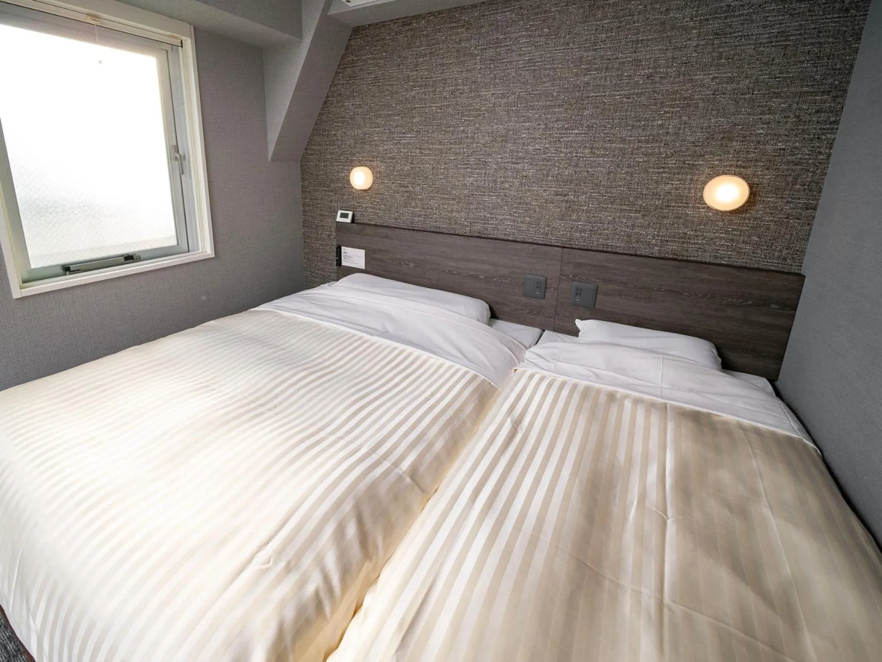 Bed in SUPER HOTEL Ikebukuro West Natural Hot Spring