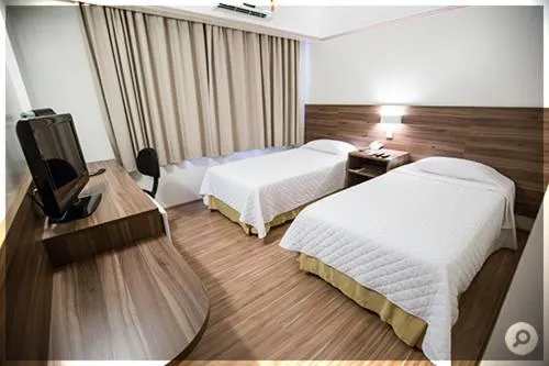 Bed in Mogano Business Hotel- ELETROPOSTO