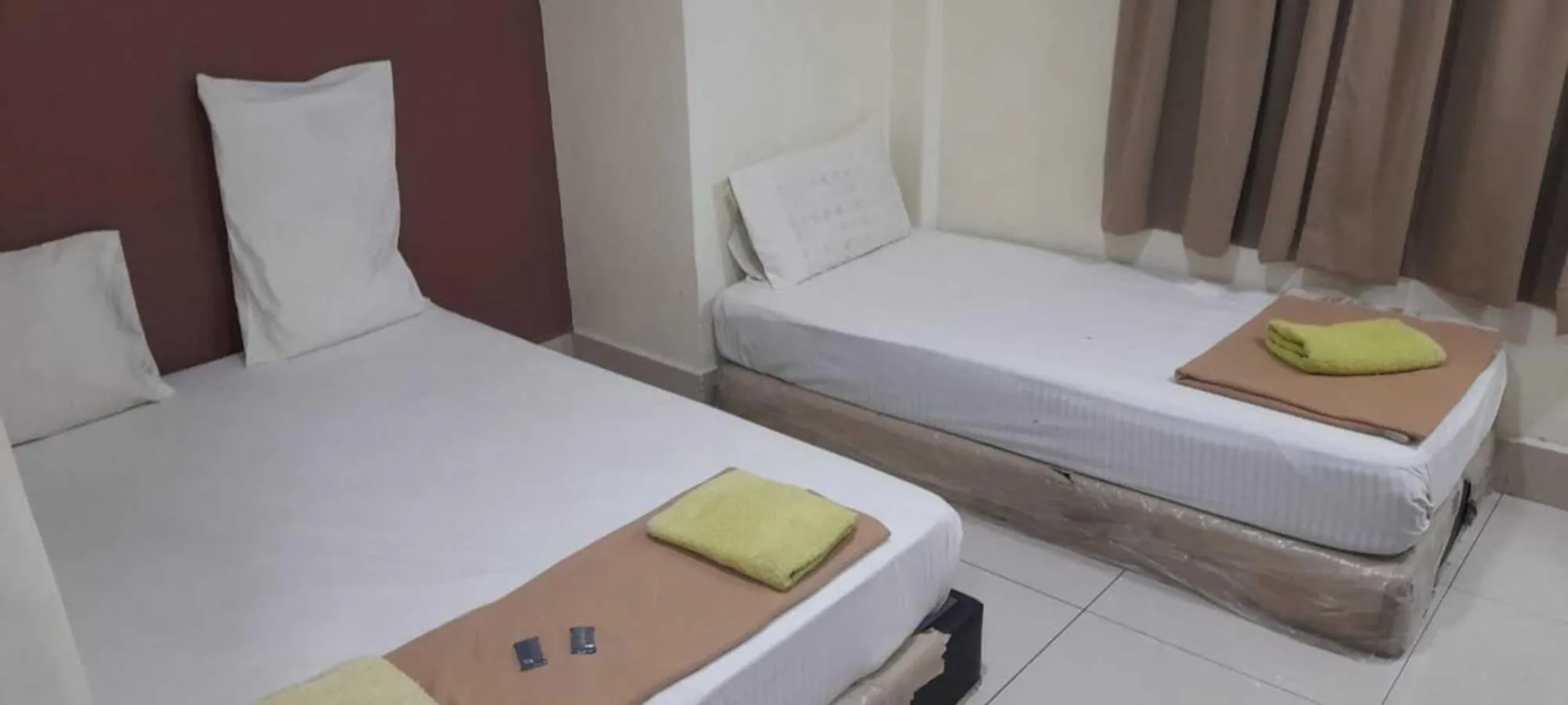 Bed in SV Andalas Hotel