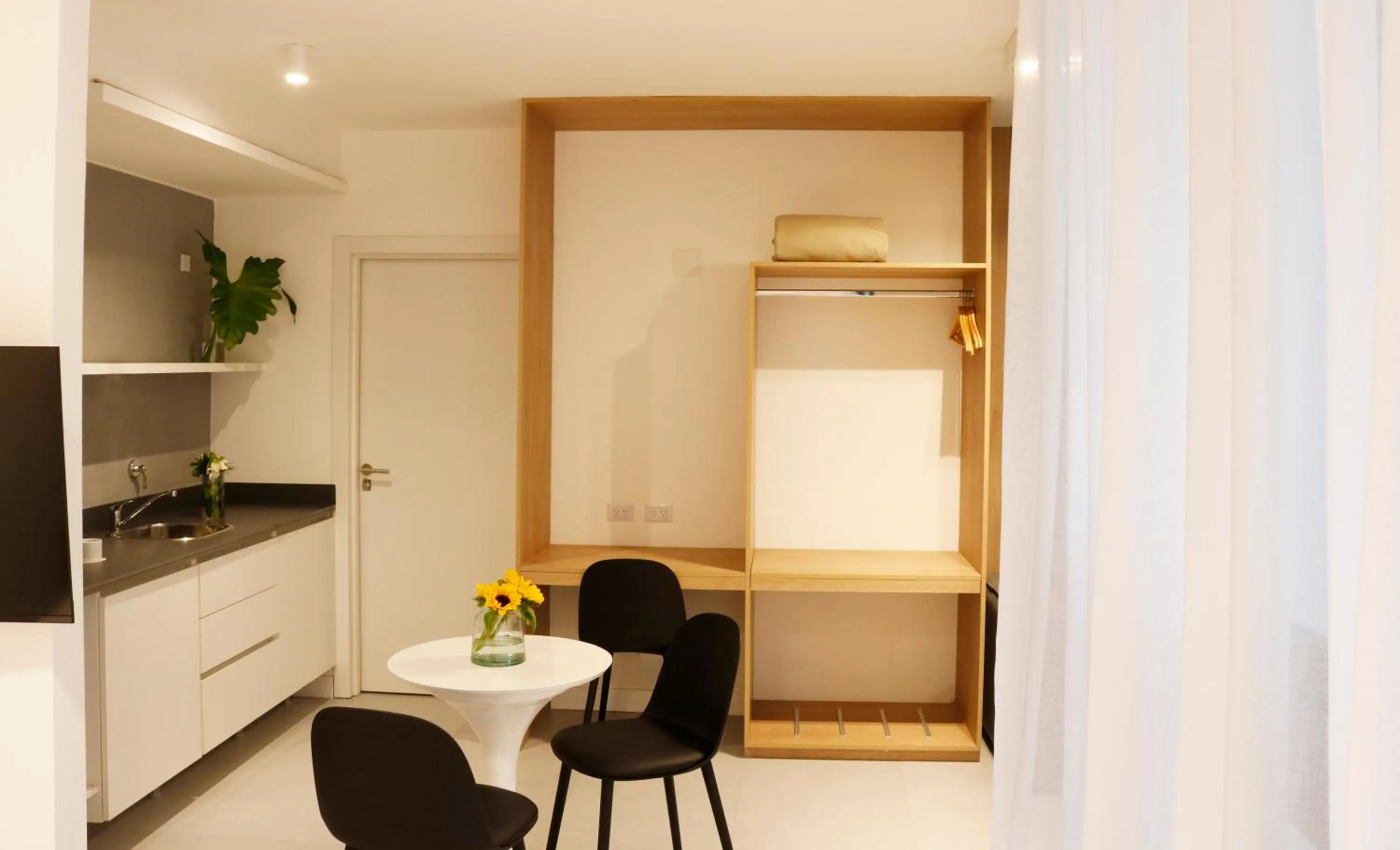 Dining area in OWN Palermo