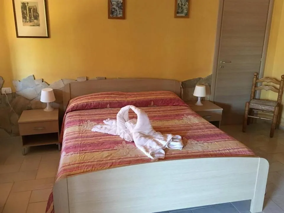 Bed in Hotel Villaggio Stromboli