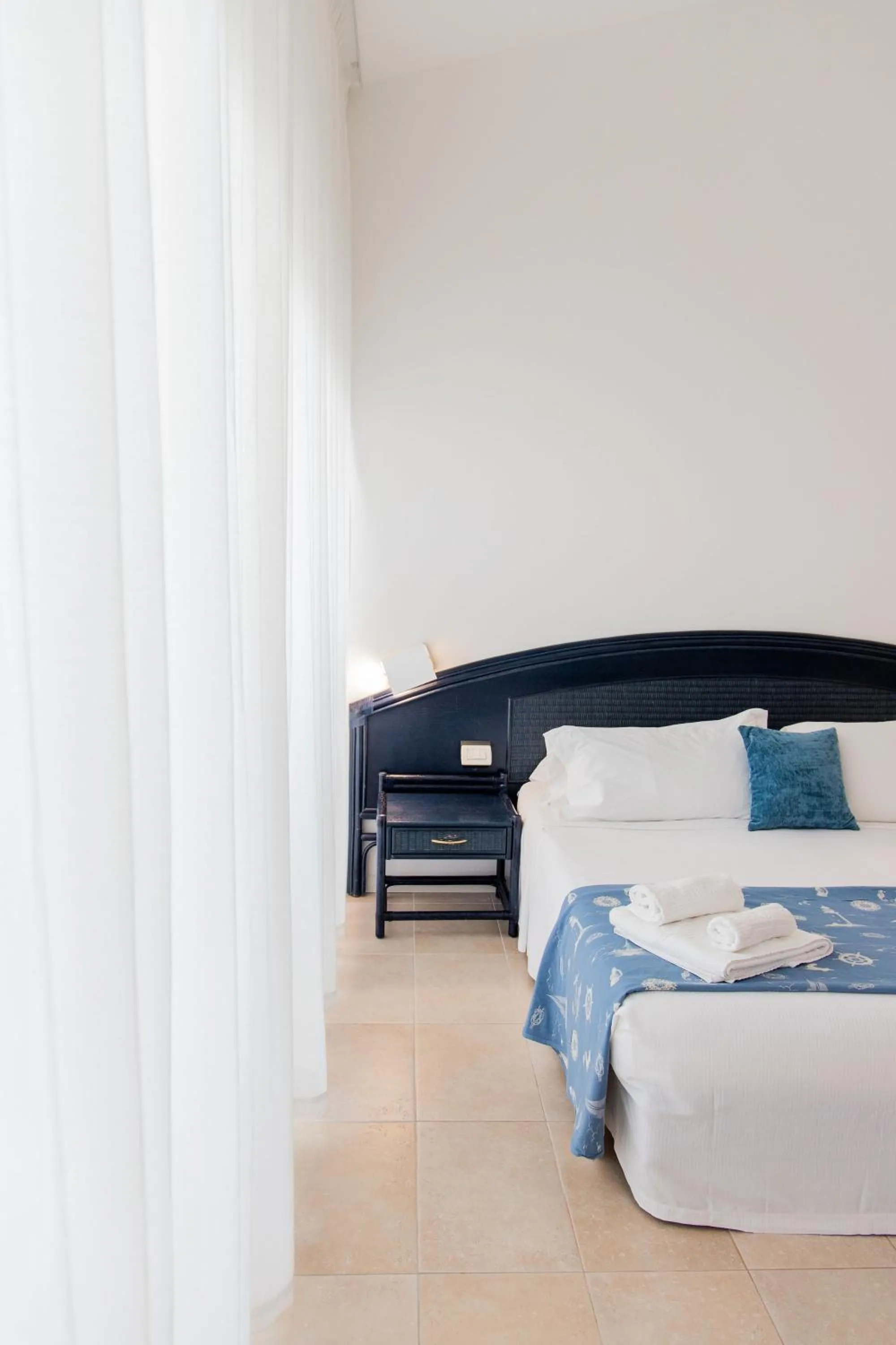 Bed in Hotel Villaggio Stromboli