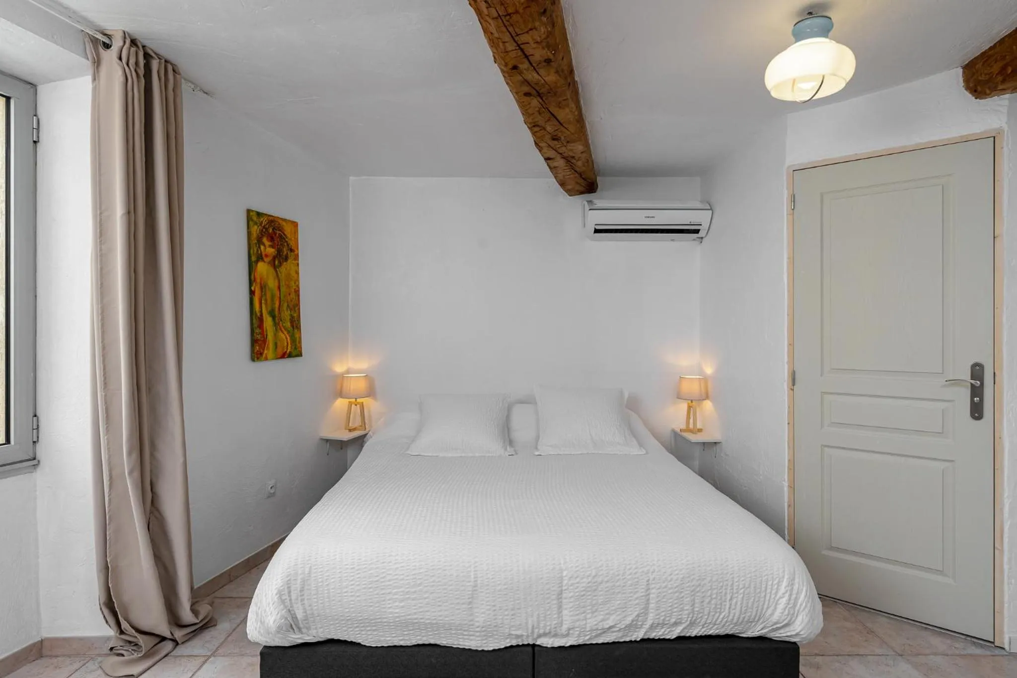 Bed in Maison Carles BnB