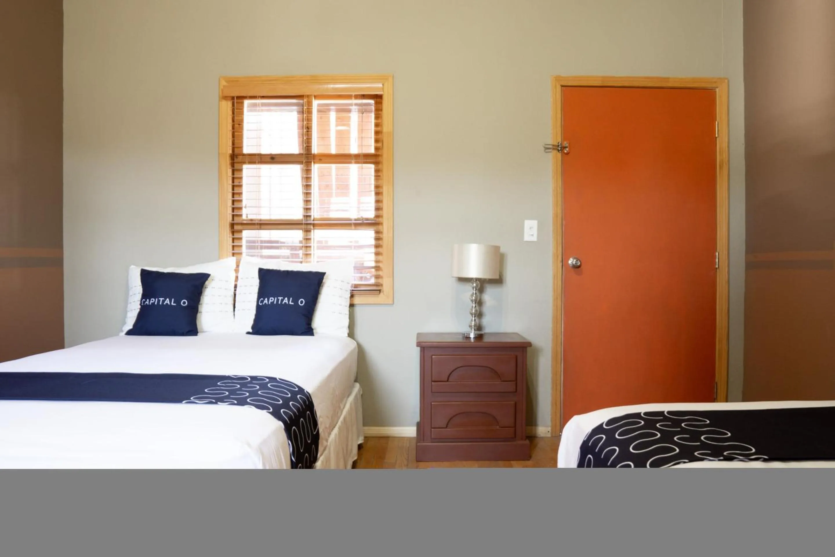 Bedroom, Bed in Capital O Hotel Villa Azura