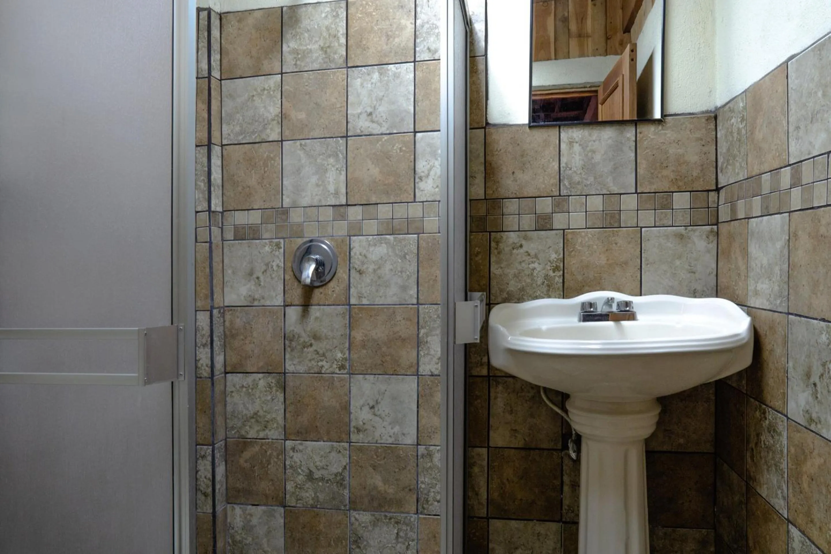 Bathroom in Capital O Hotel Villa Azura