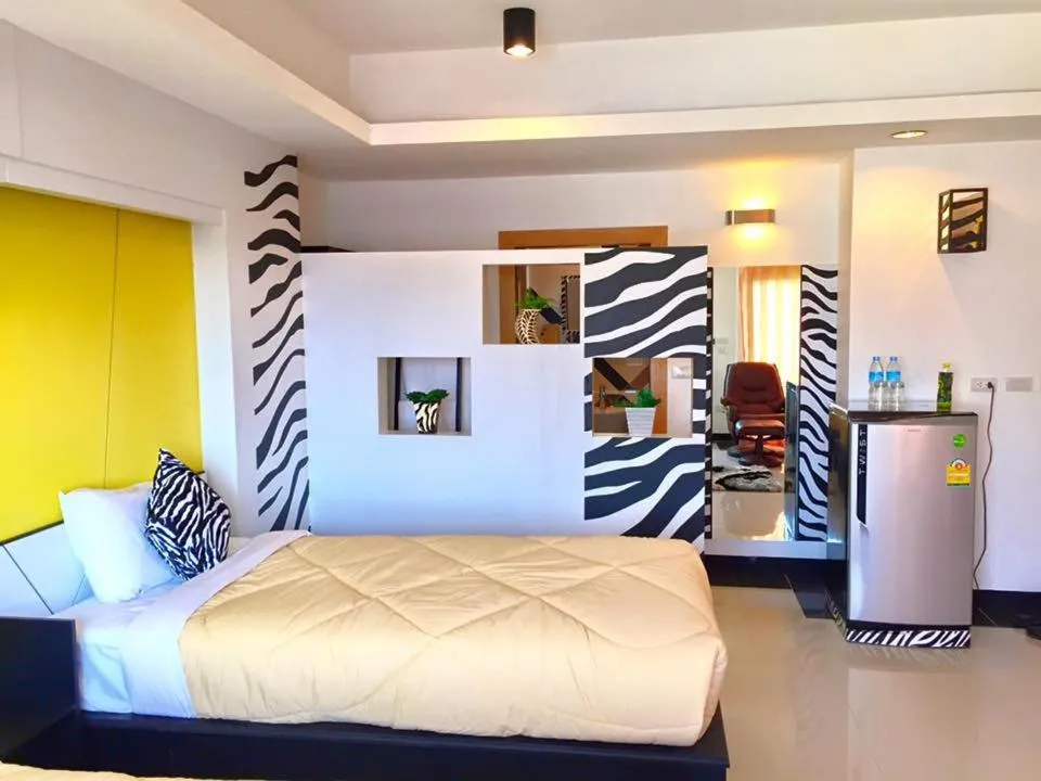 Photo of the whole room, Bed in Win Hotel Phayao