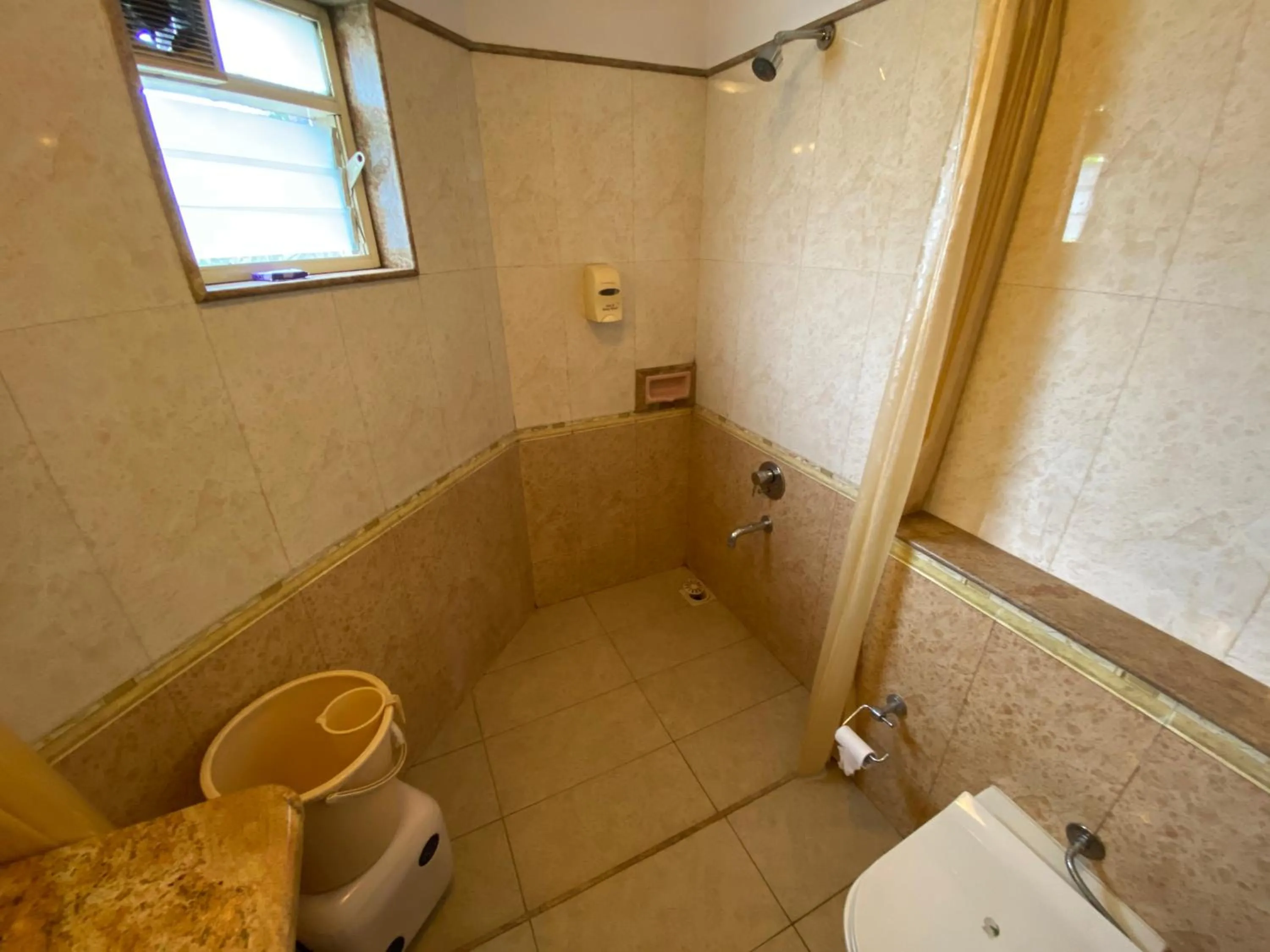 Bathroom in Panchavati Elite Inn