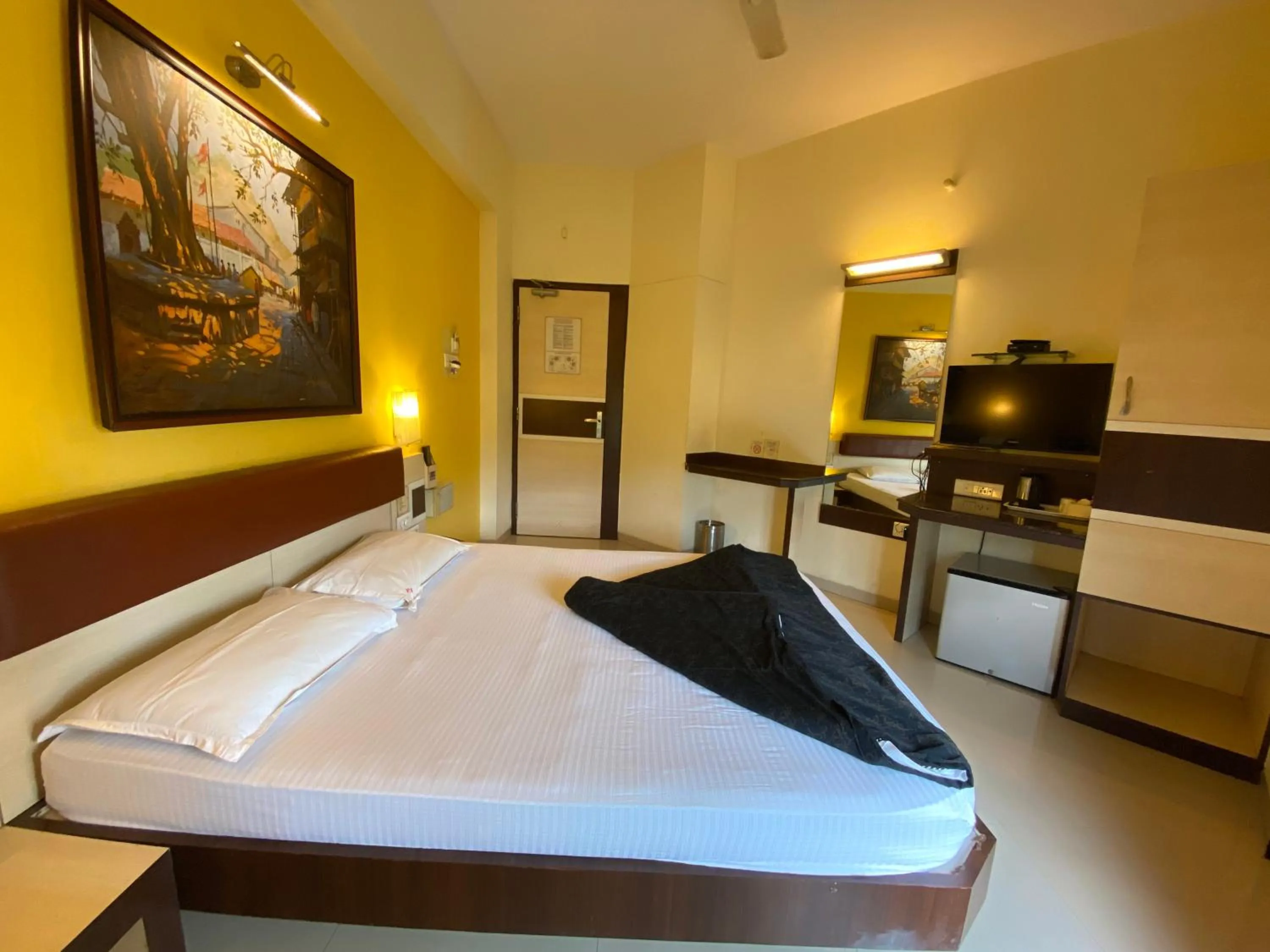 Bed in Panchavati Elite Inn