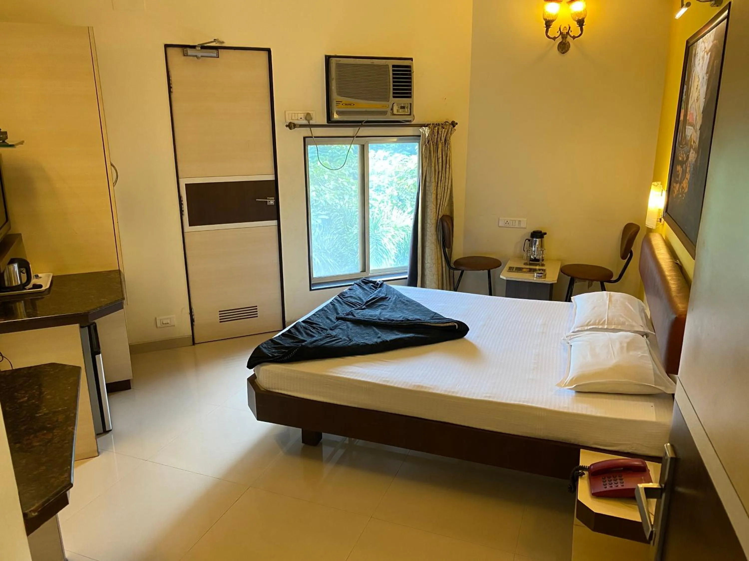 Bed in Panchavati Elite Inn