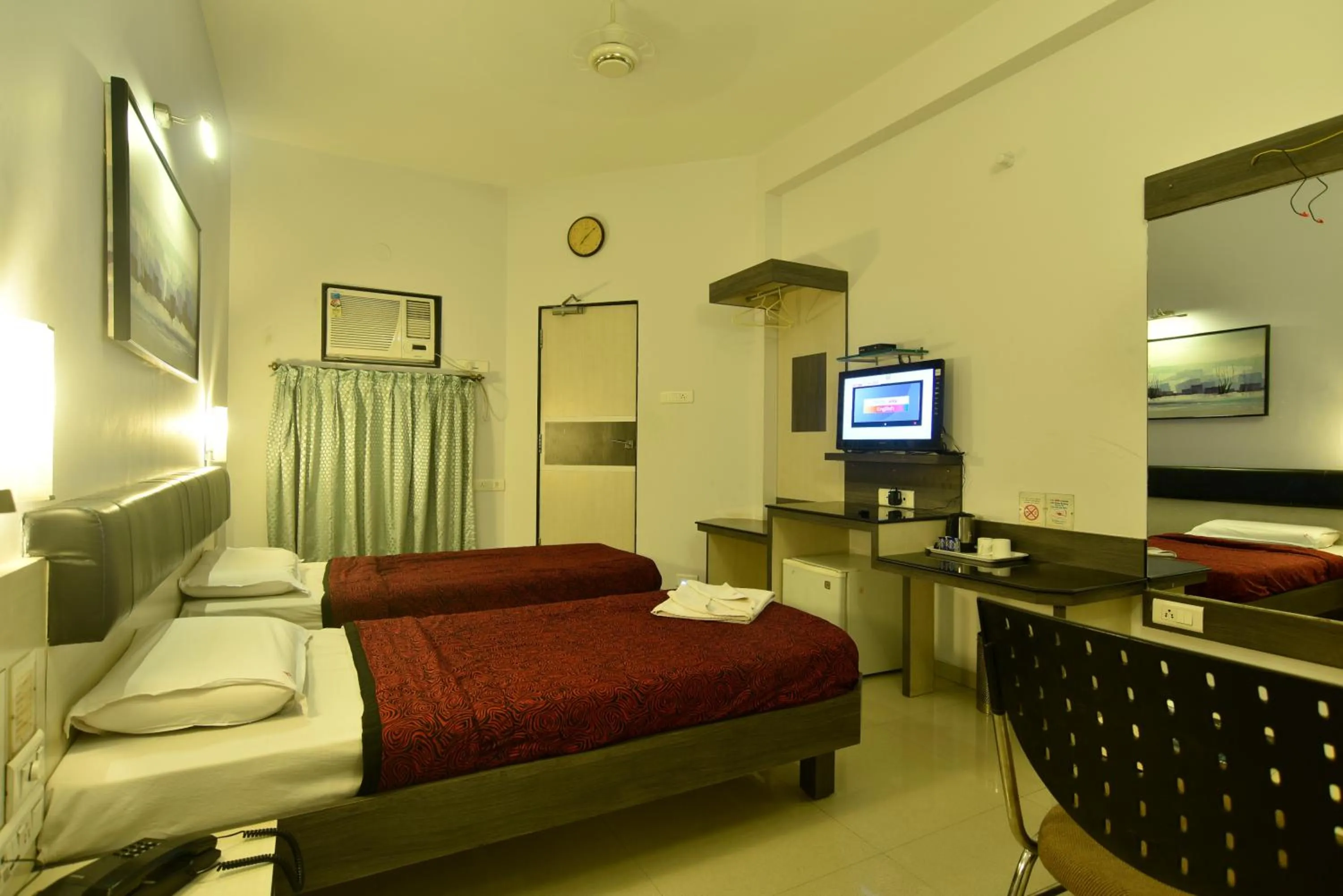 Bed in Panchavati Elite Inn