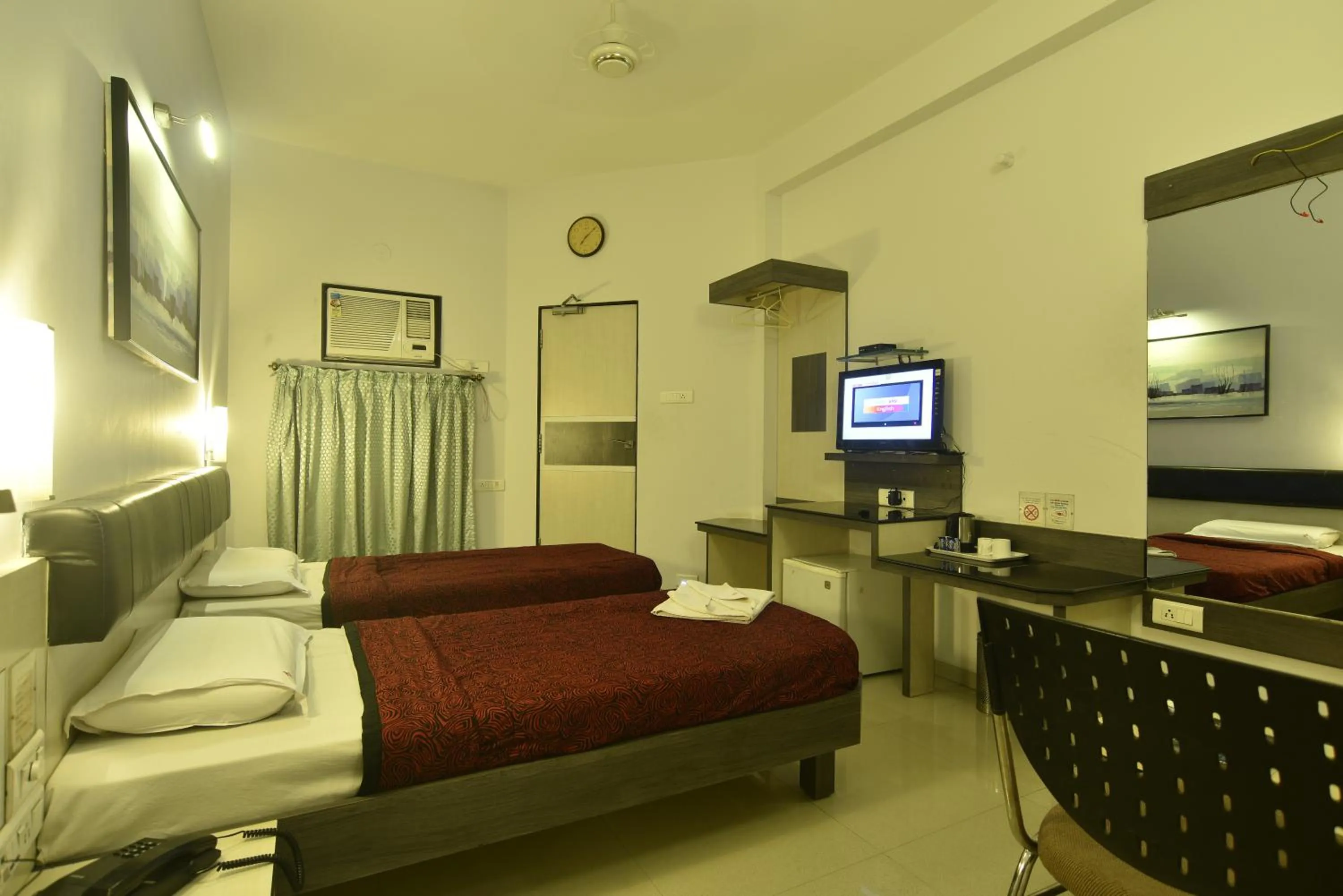 Bed in Panchavati Elite Inn