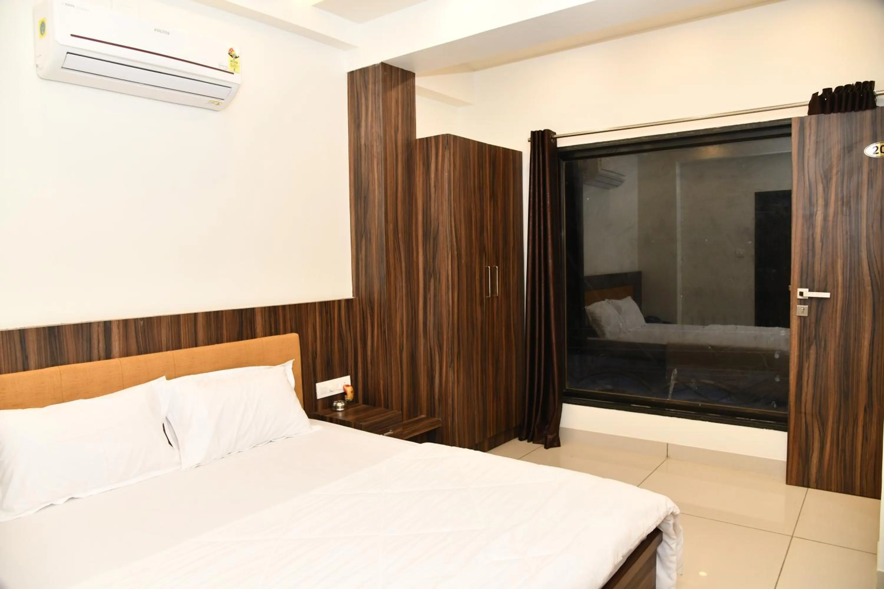 Bed in Hotel Shreeji Palace